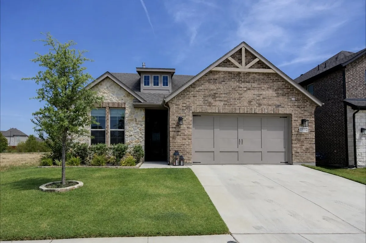 Brick and stone exterior with dormer window detail
