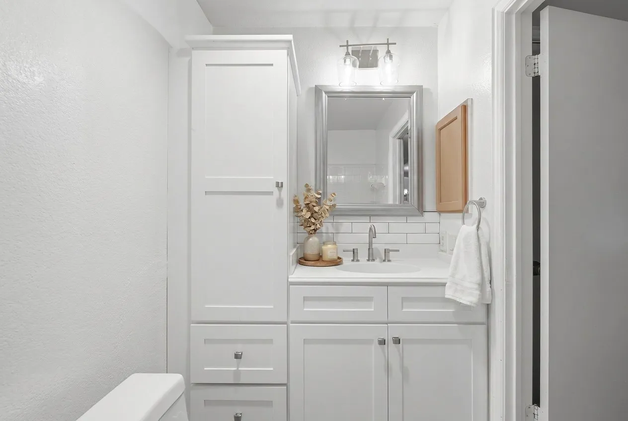 Full bathroom with updated cabinets, light fixture - servicing guests and secondary bedrooms.