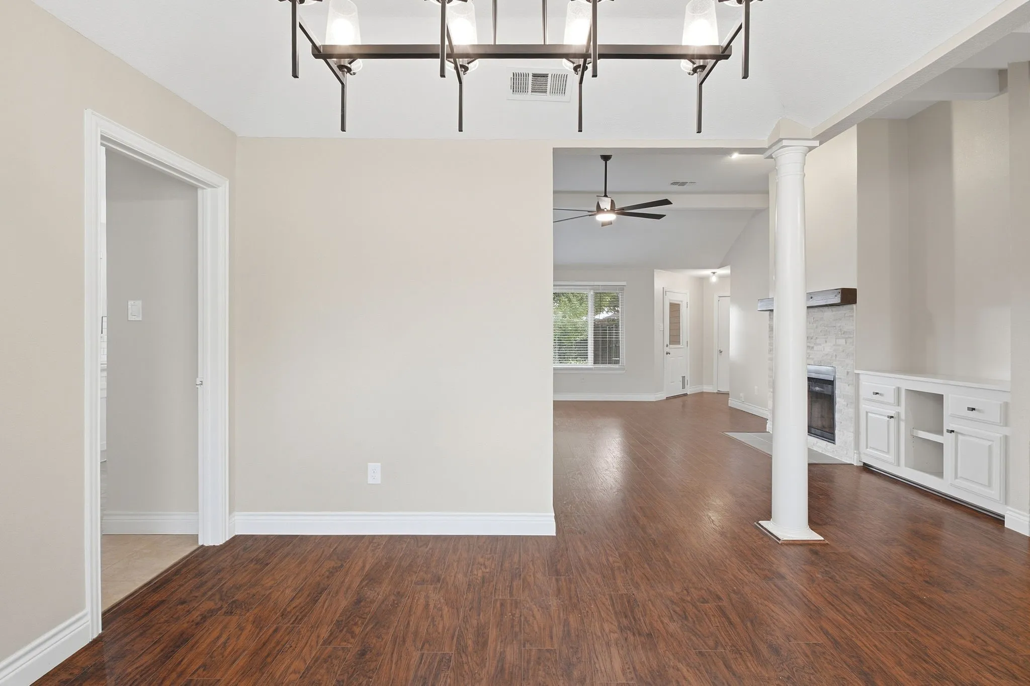 Dining room with views leading toward the living room and to the left is the Kitchen.