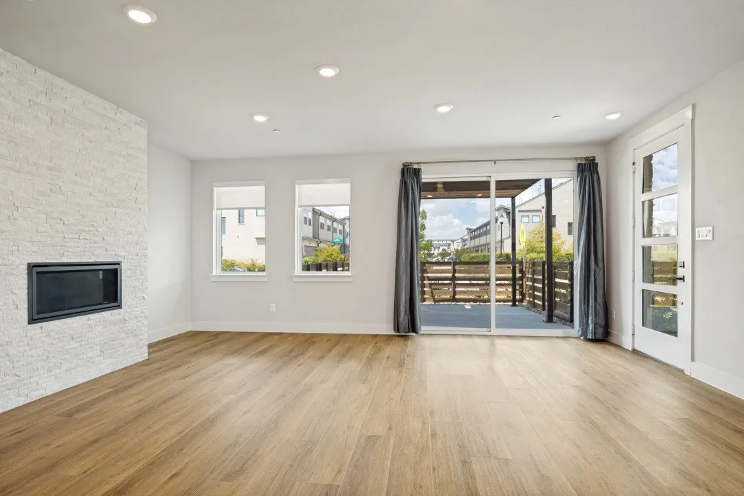 Expansive living area, custom fireplace. Oversized patio with that is ALWAYS in the shade in this North facing end unit