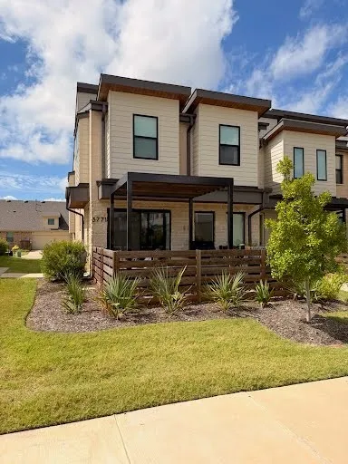 Modern facade with horizontal siding and brick accents