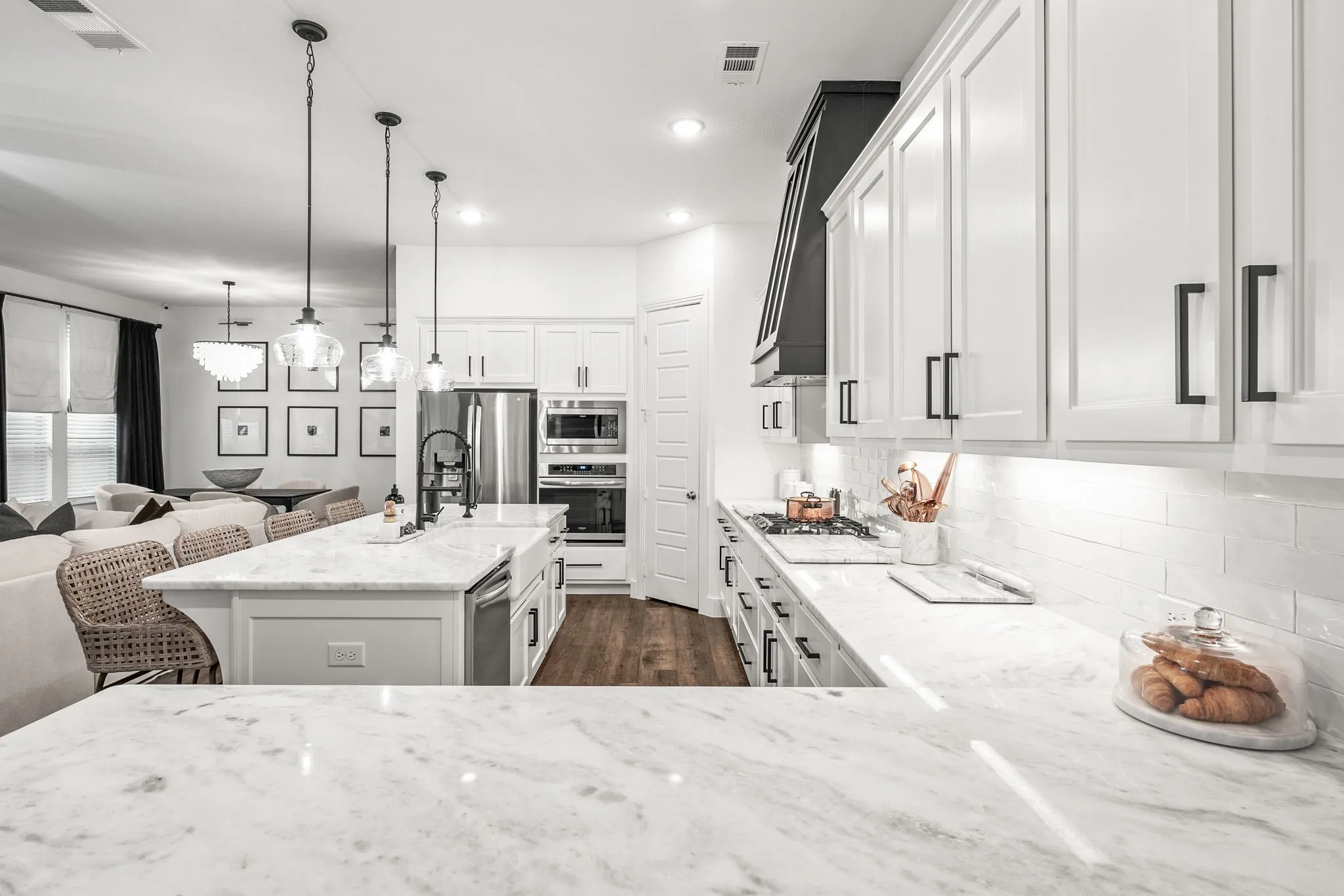 Extended quartz kitchen countertops to service food prep or more stools for additional seating.
