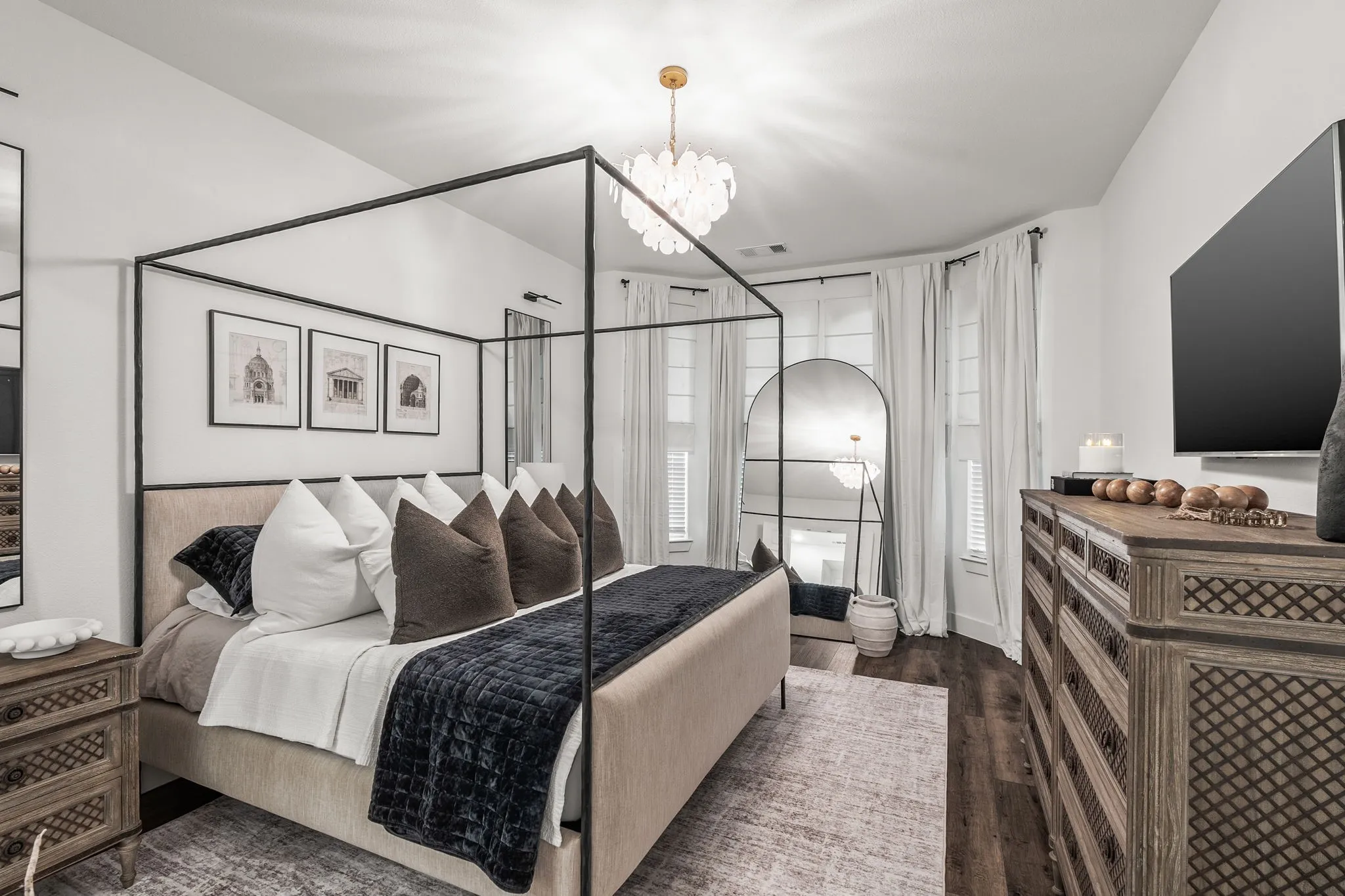 Large primary bedroom with pretty bay windows, great for a seating area.