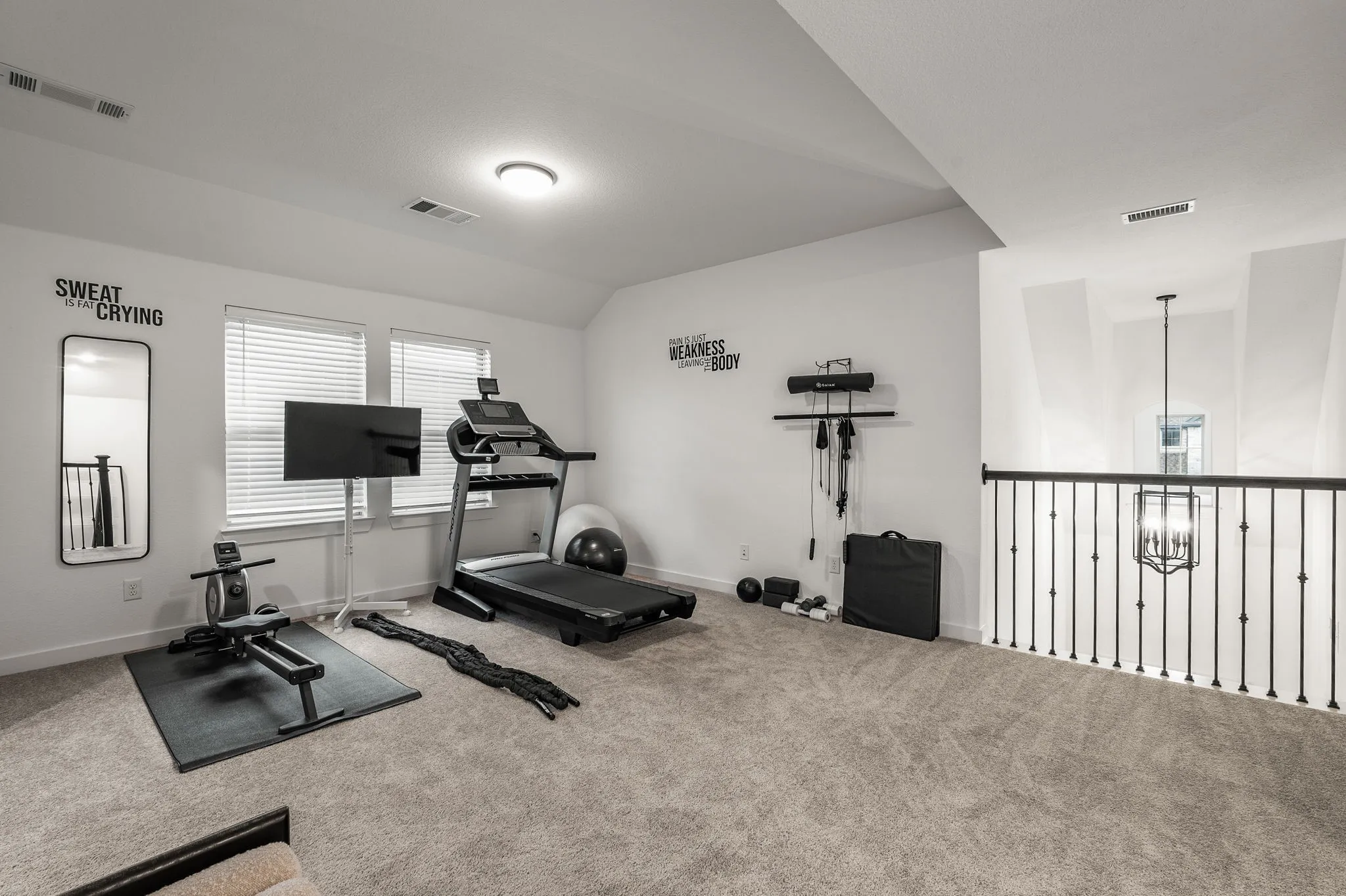 Game room/loft area currently being used as an exercise room.