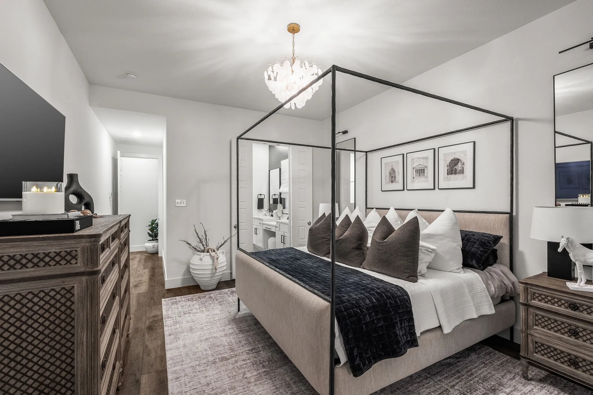Primary bedroom privately tucked toward the rear of the home with bay windows.