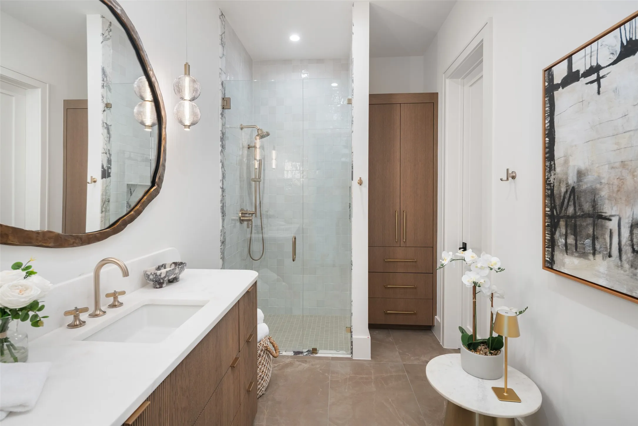 Wood-finish vanity with an integrated rectangular sink and gold-tone faucet