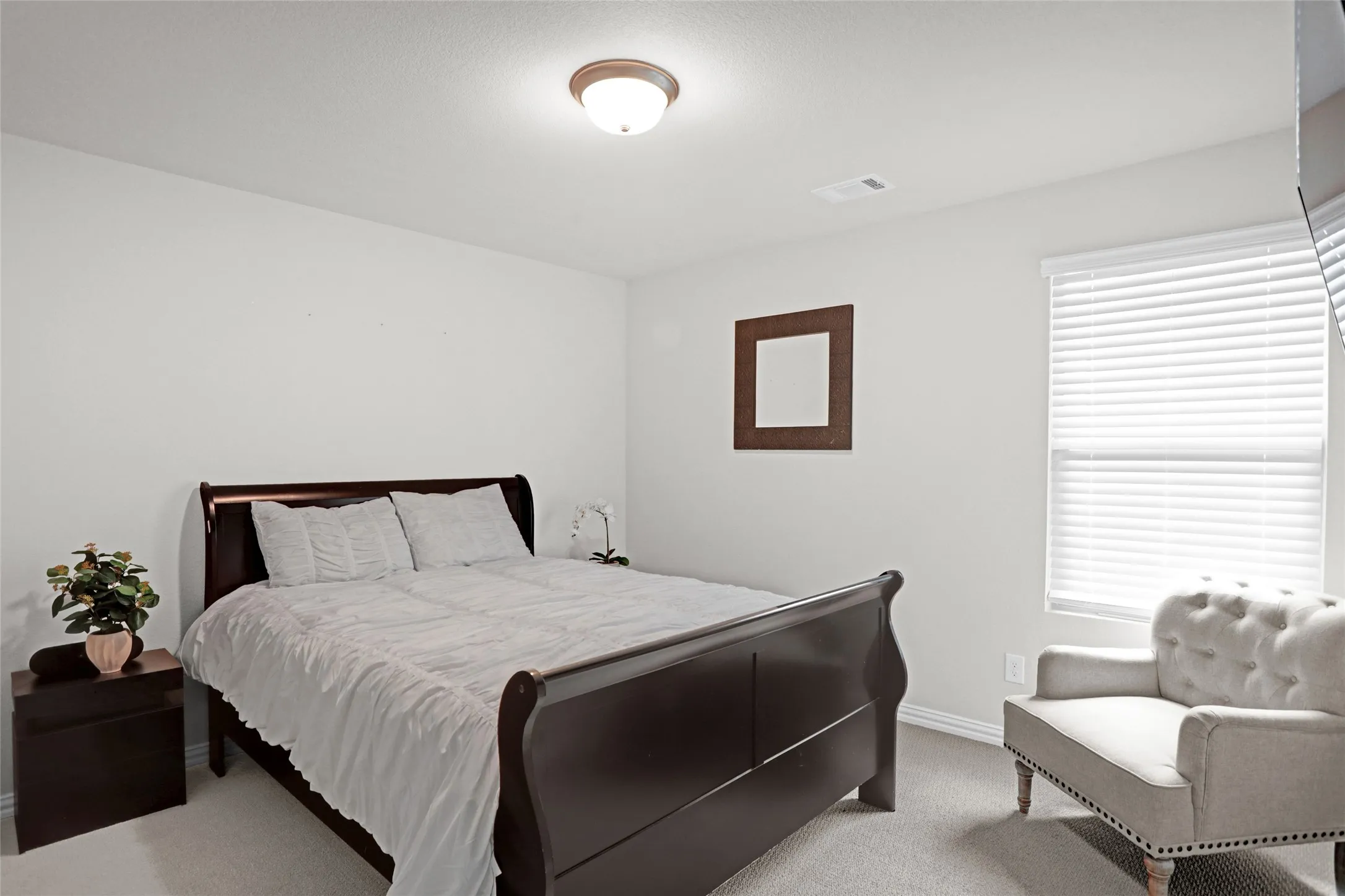 Bedroom with carpet and baseboards