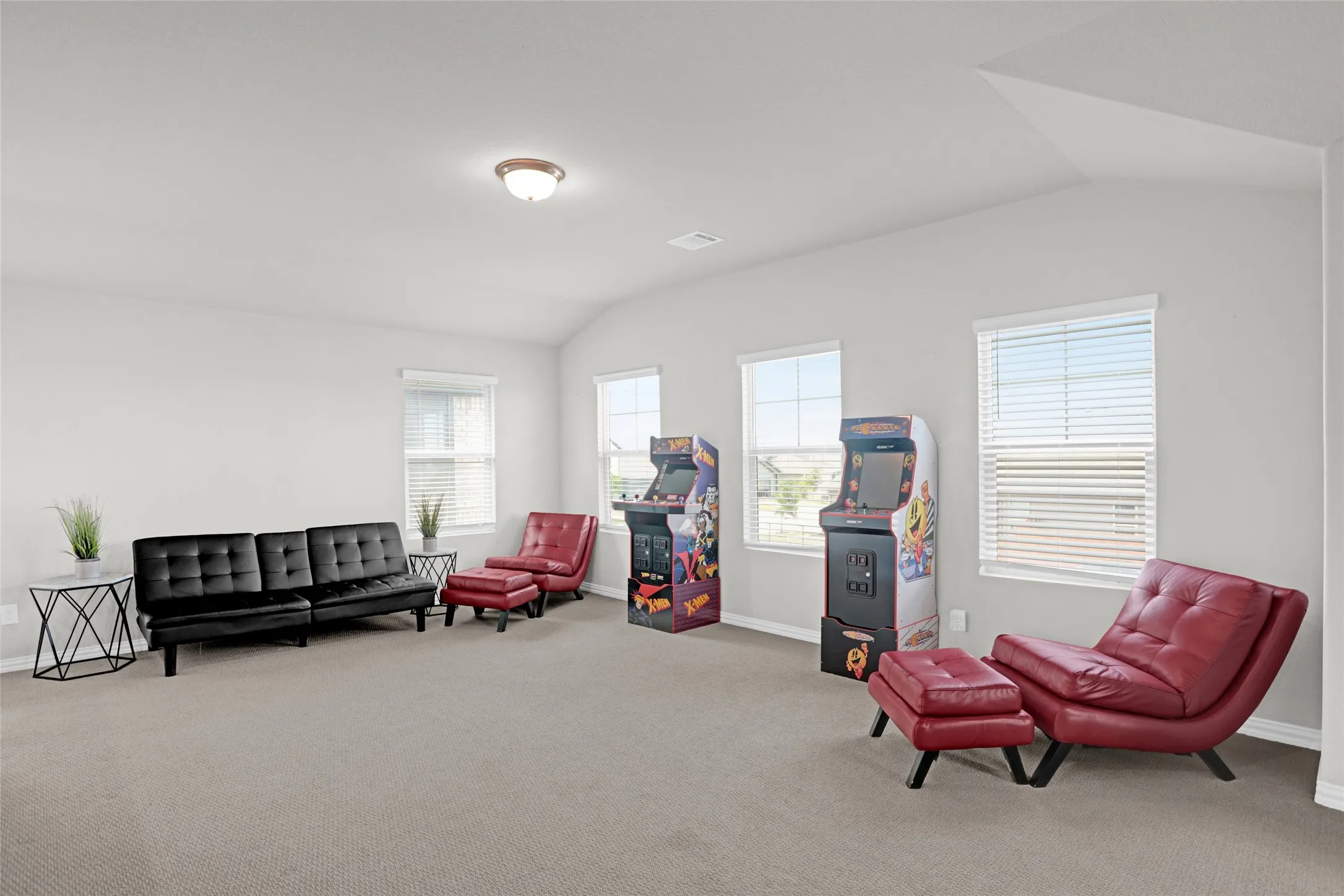 Living area with lofted ceiling and carpet