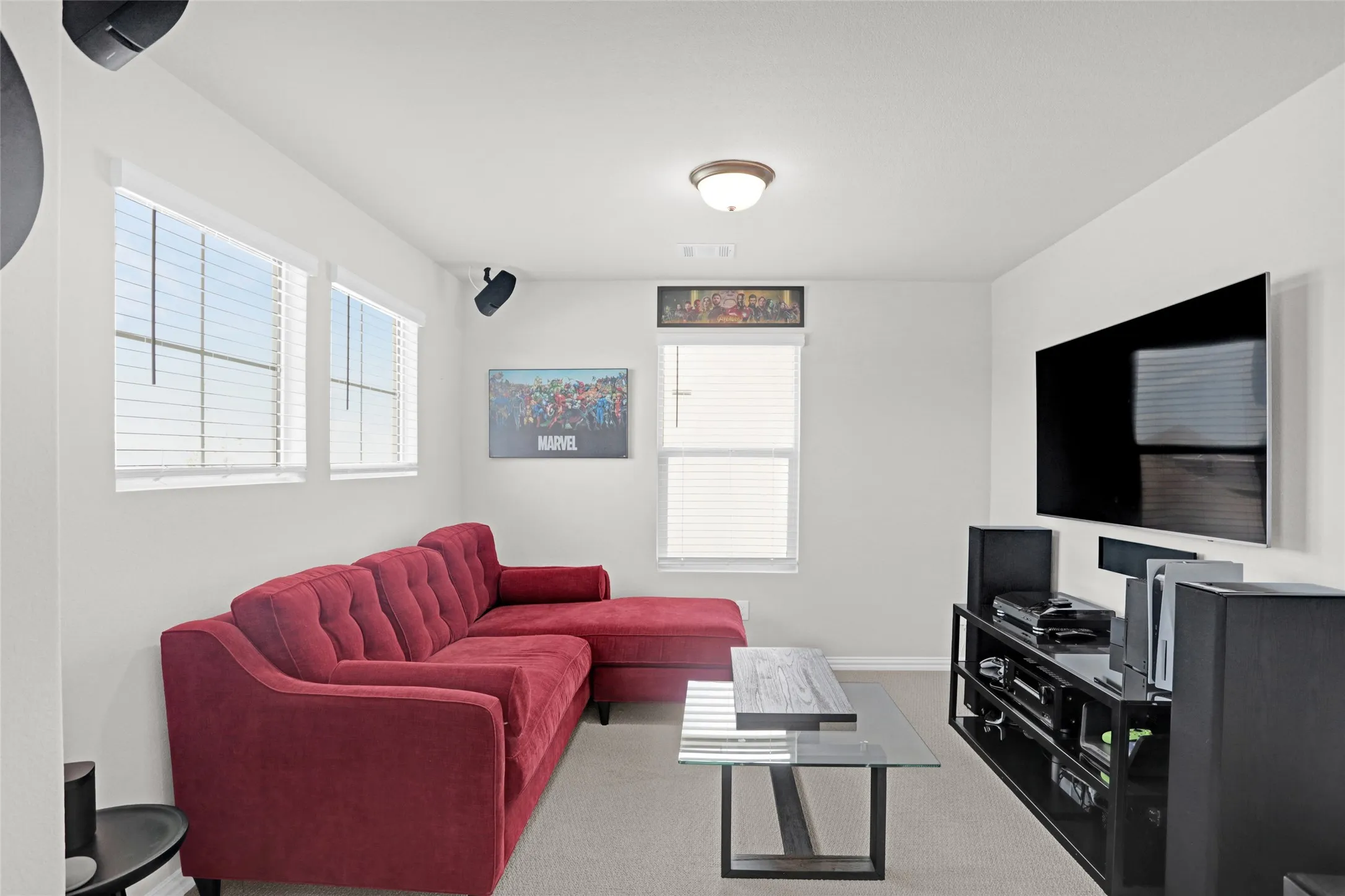 Carpeted living area with baseboards