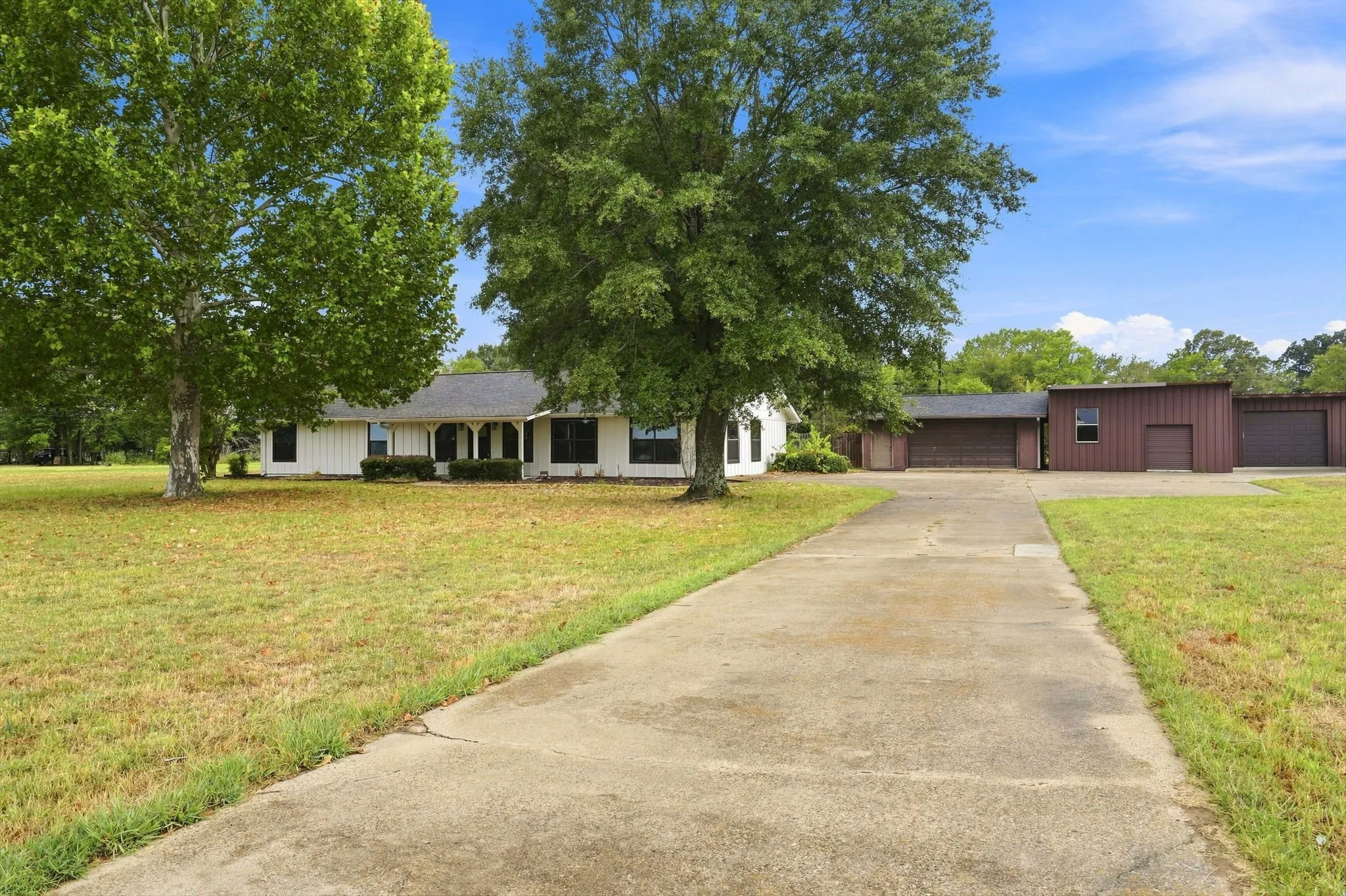 Concrete driveway leading to the residence