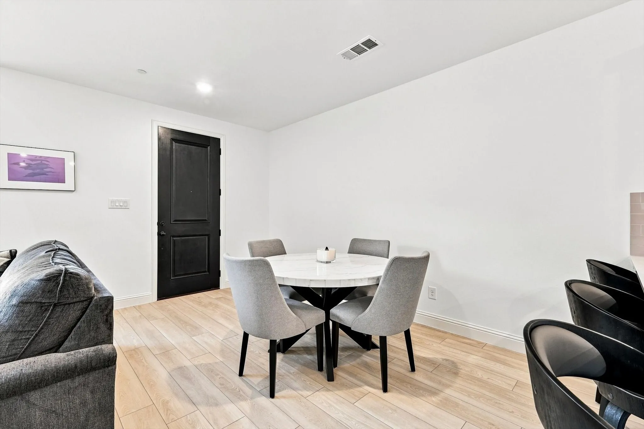 A dedicated dining space offers the perfect setting for morning coffee, intimate dinners, or gathering with friends—all just steps from the kitchen.
