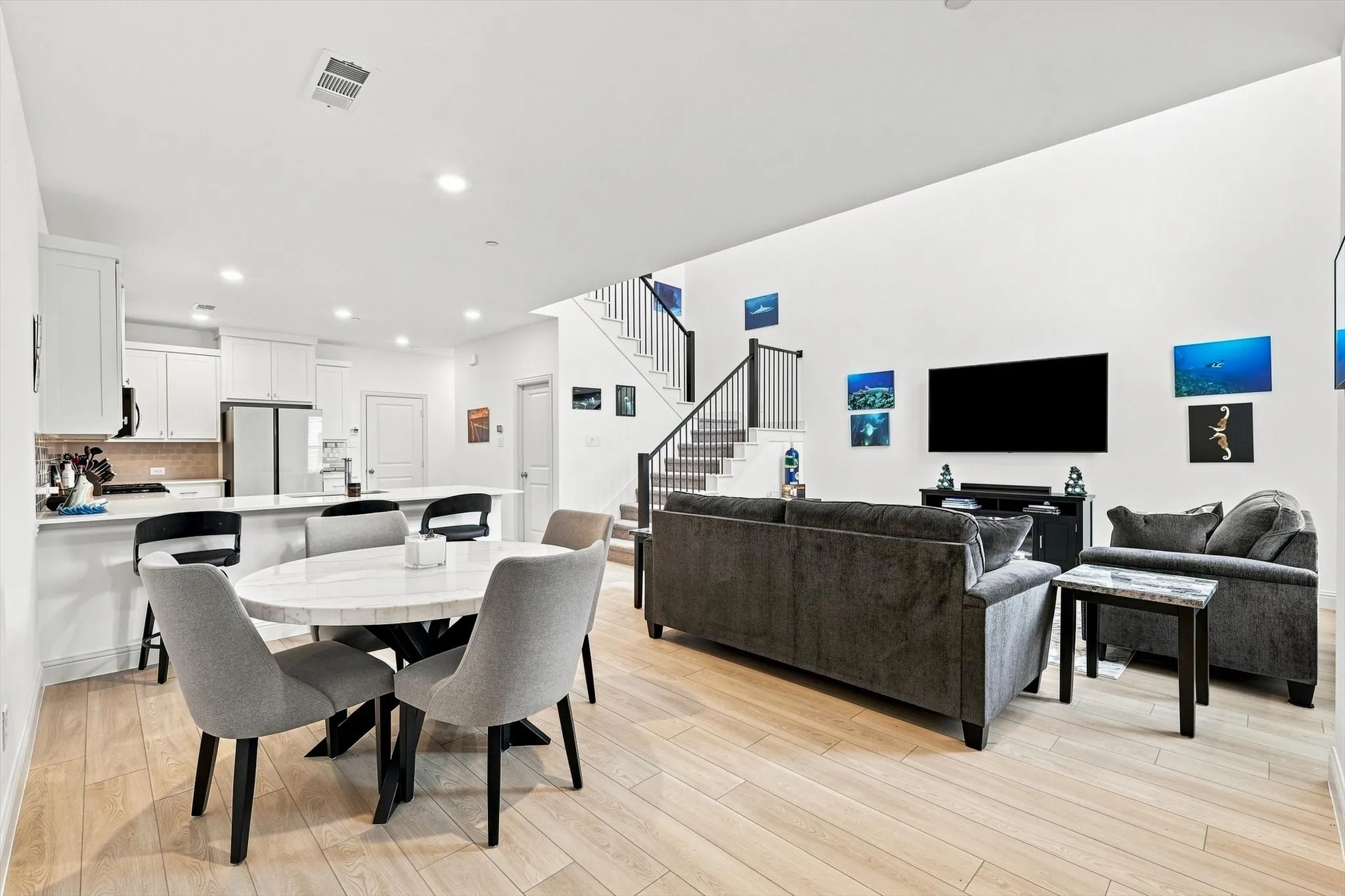 This is the floor plan buyers are looking for. Kitchen, dining, and living spaces come together in one expansive, light-filled setting made for connection.
