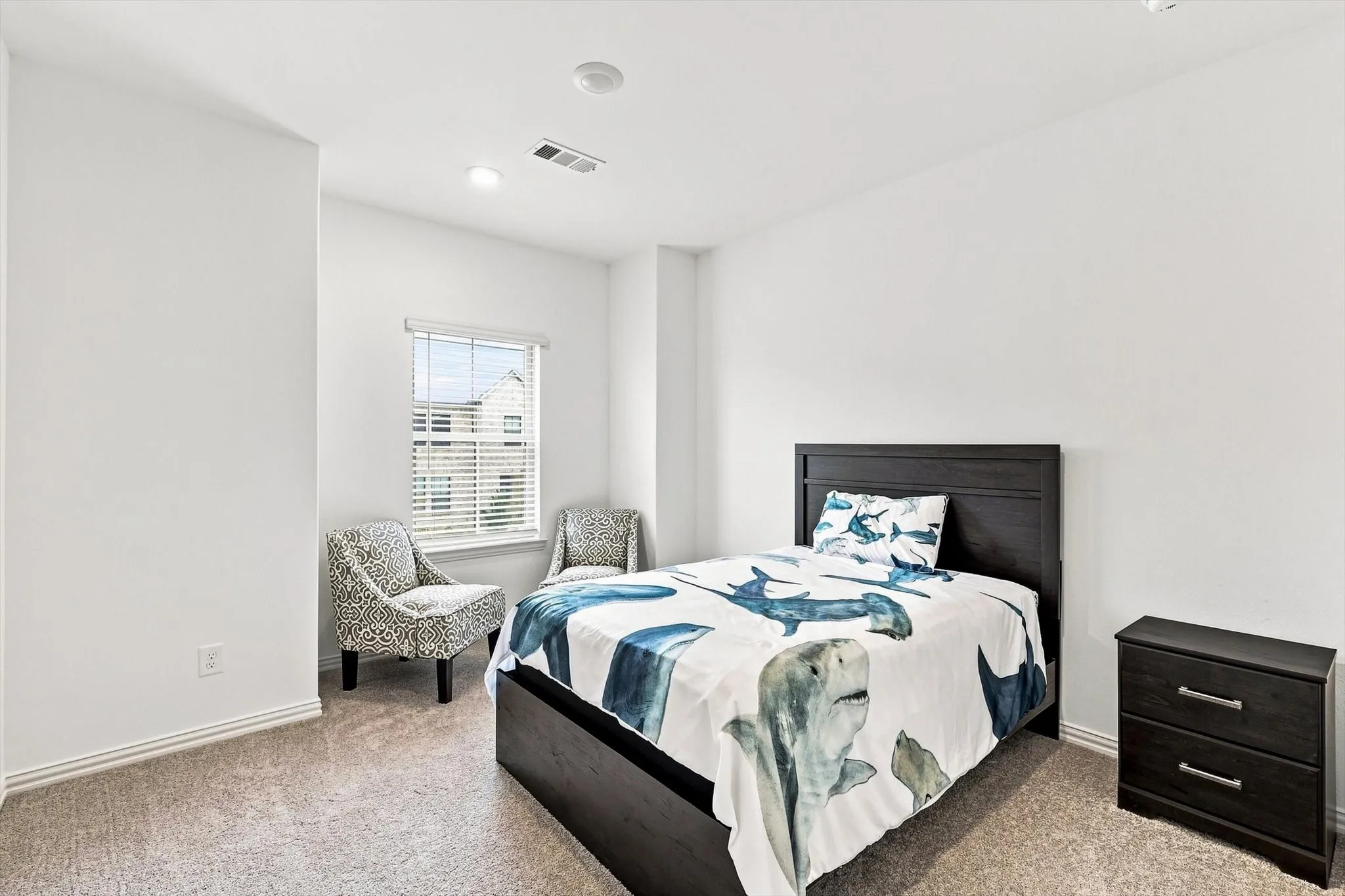 Bright, spacious, and inviting, this secondary bedroom offers plenty of room to unwind, recharge, or create a personalized retreat.