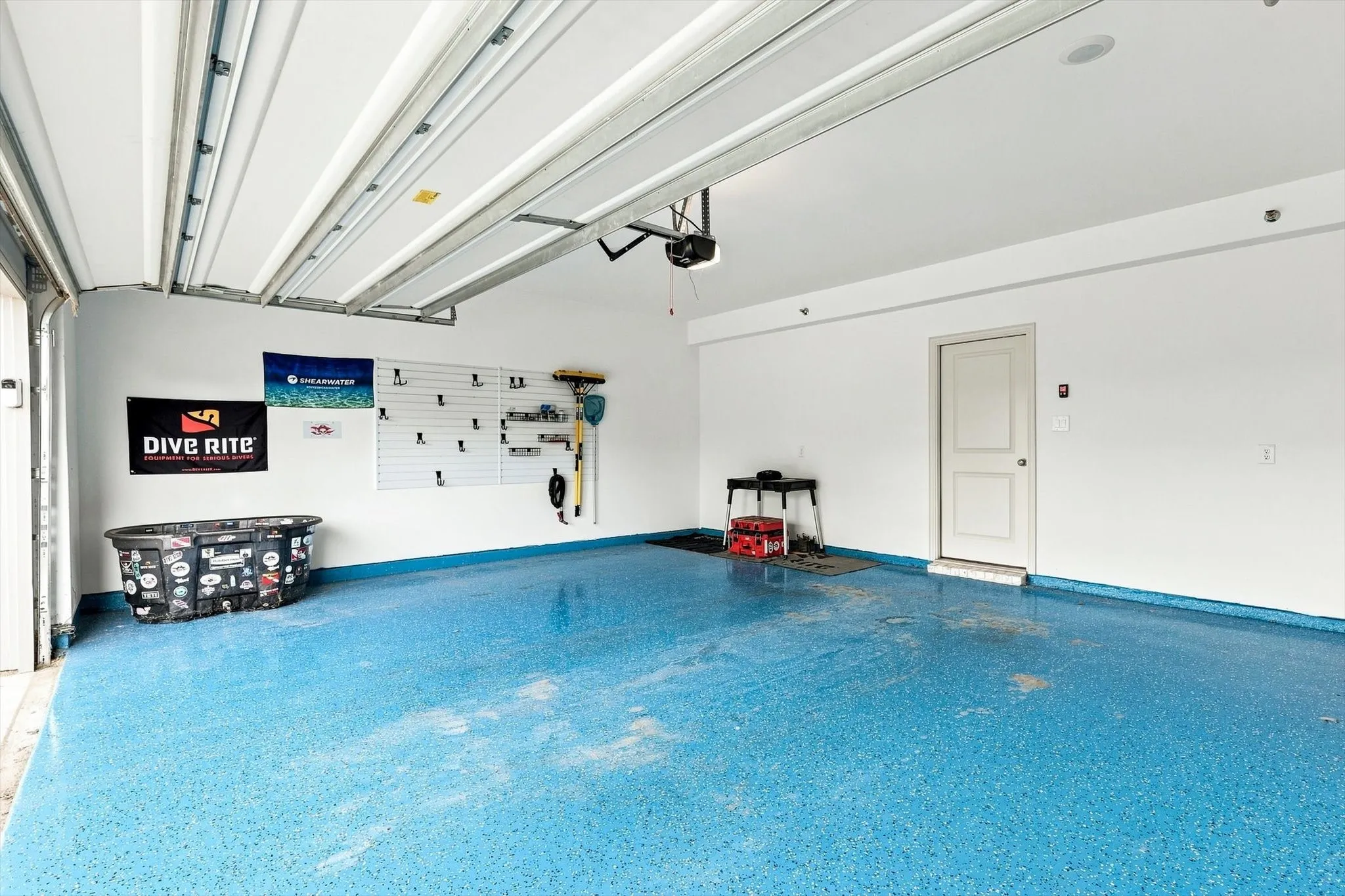 Generous garage space, built-in organization potential, and a finished floor make this an ideal setup for vehicles, storage, hobbies, and weekend projects.