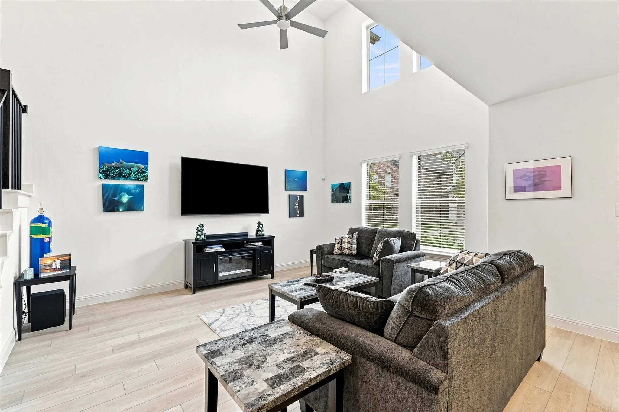 This is the wow moment. Soaring ceilings, incredible natural light, and an airy two-story design make this living room the showpiece of the home.
