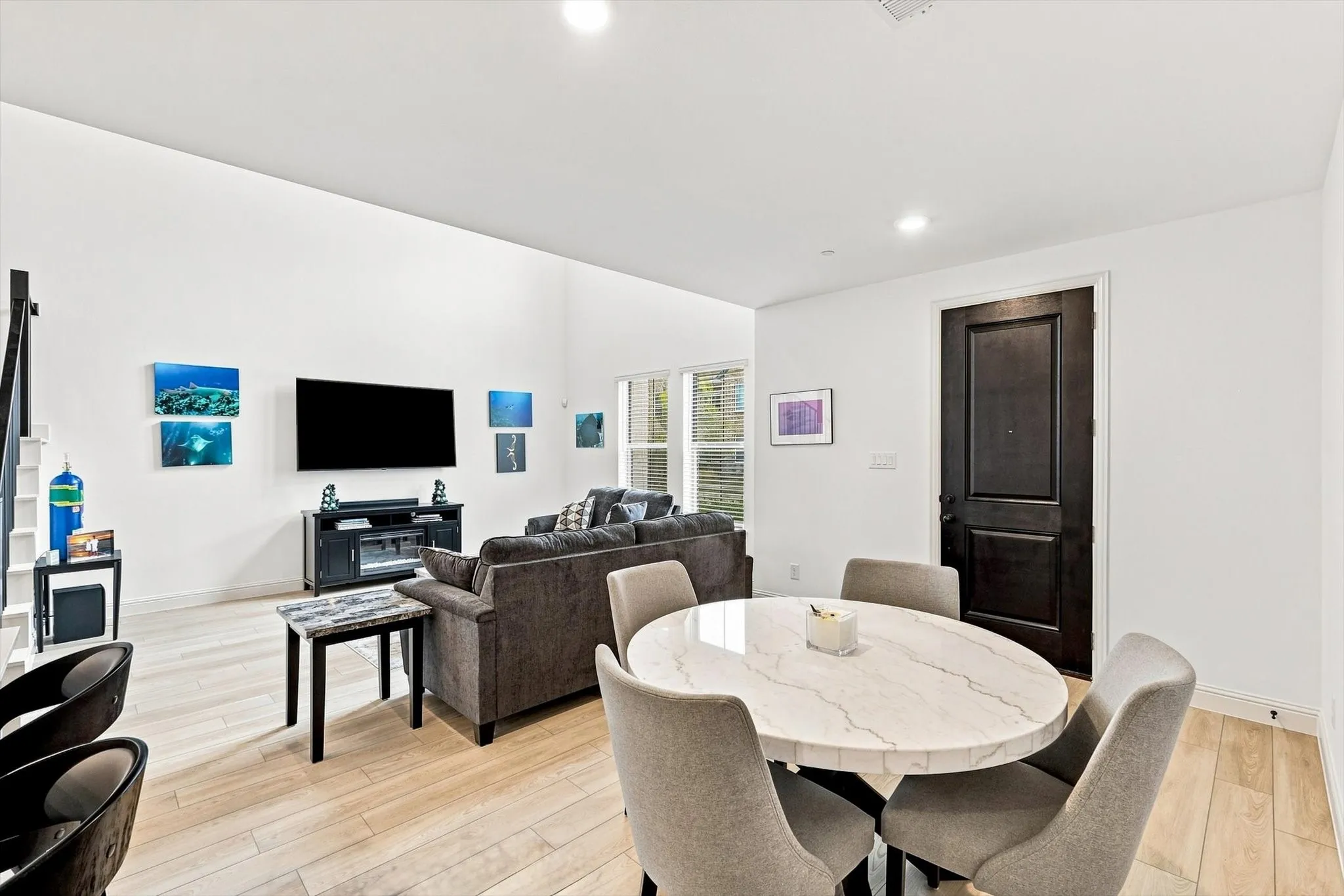 Open-concept living done right. The dining area flows naturally into the dramatic living room, creating one beautifully connected space for entertaining and relaxing.