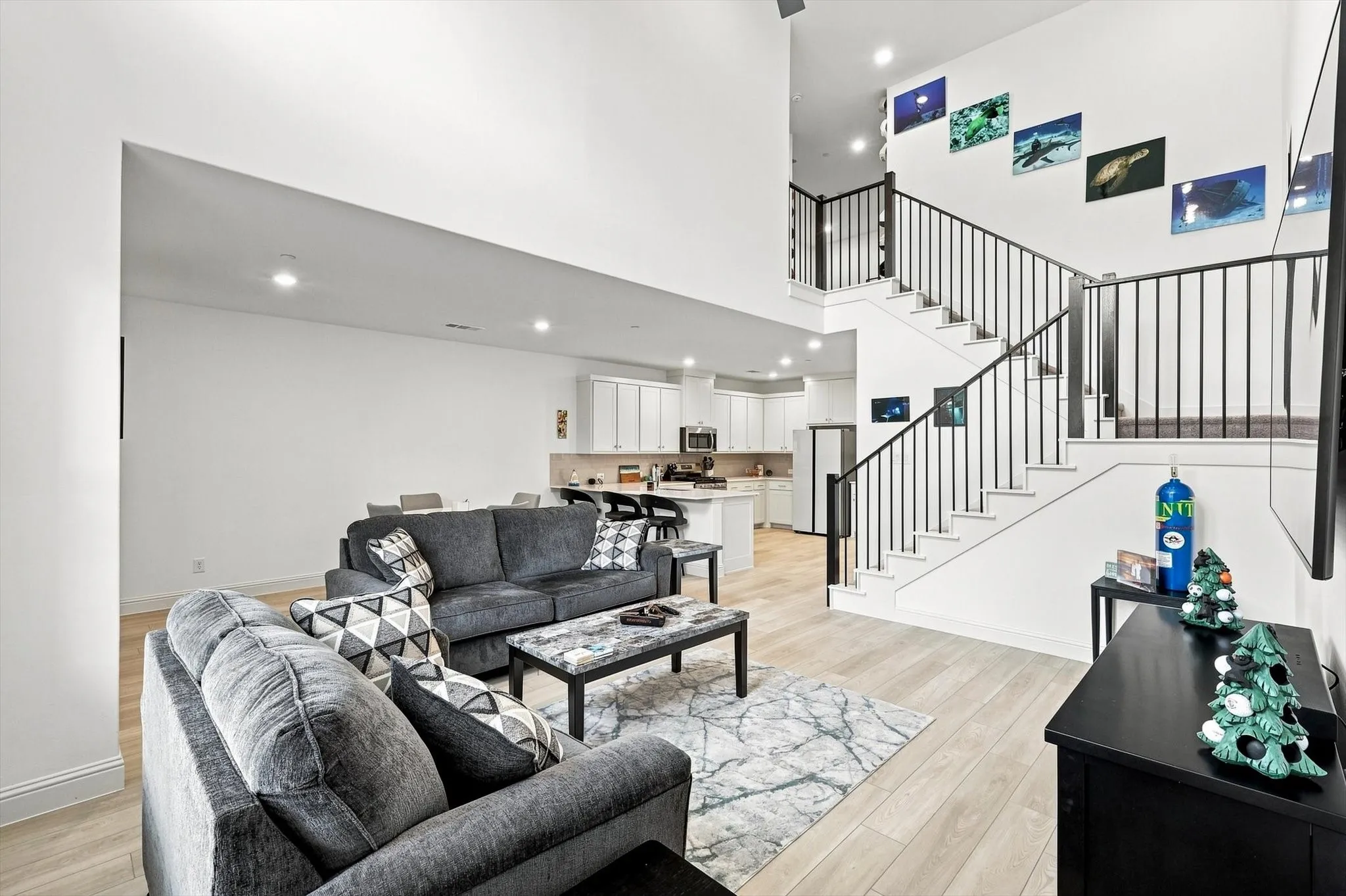 Designed to impress and made for everyday living—the dramatic living room flows seamlessly into the kitchen and dining areas for effortless entertaining.
