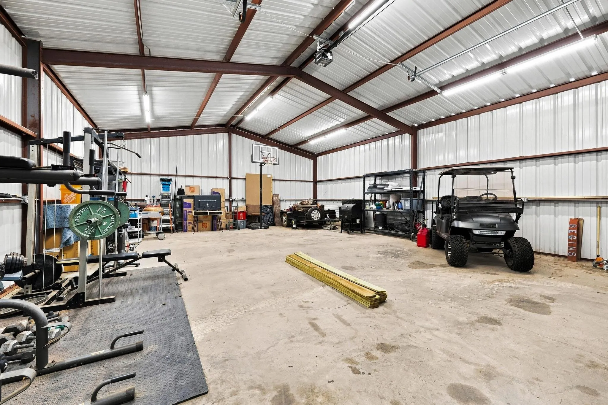 30x40 Red Iron Welded Workshop with Carport, 12ft Overhead Door, RV Plug and 100amp Service. A Really Nice Building!