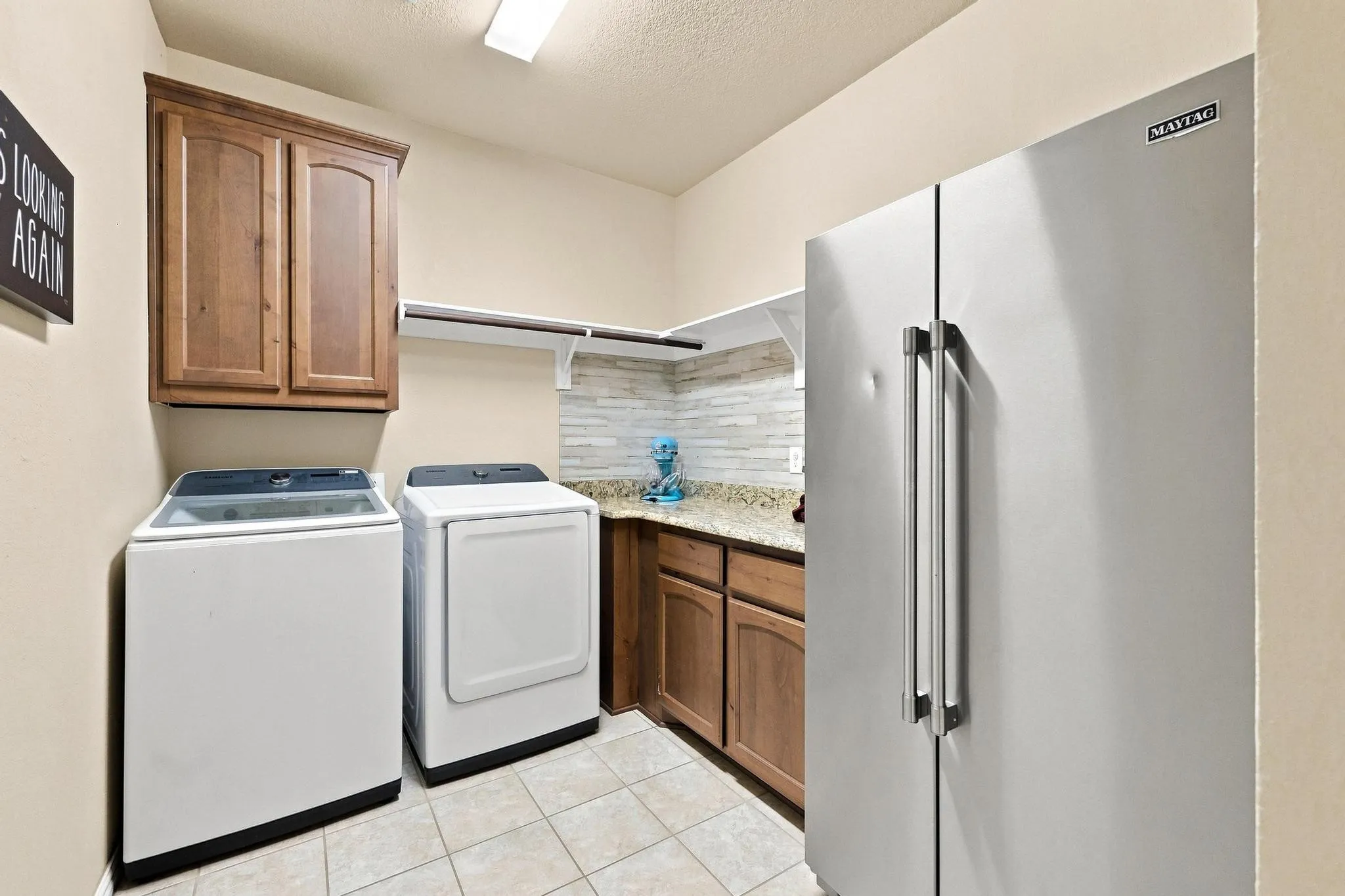 Big Laundry with Ample Counters, Cabinets and Room for a Full Size Fridge or Freezer