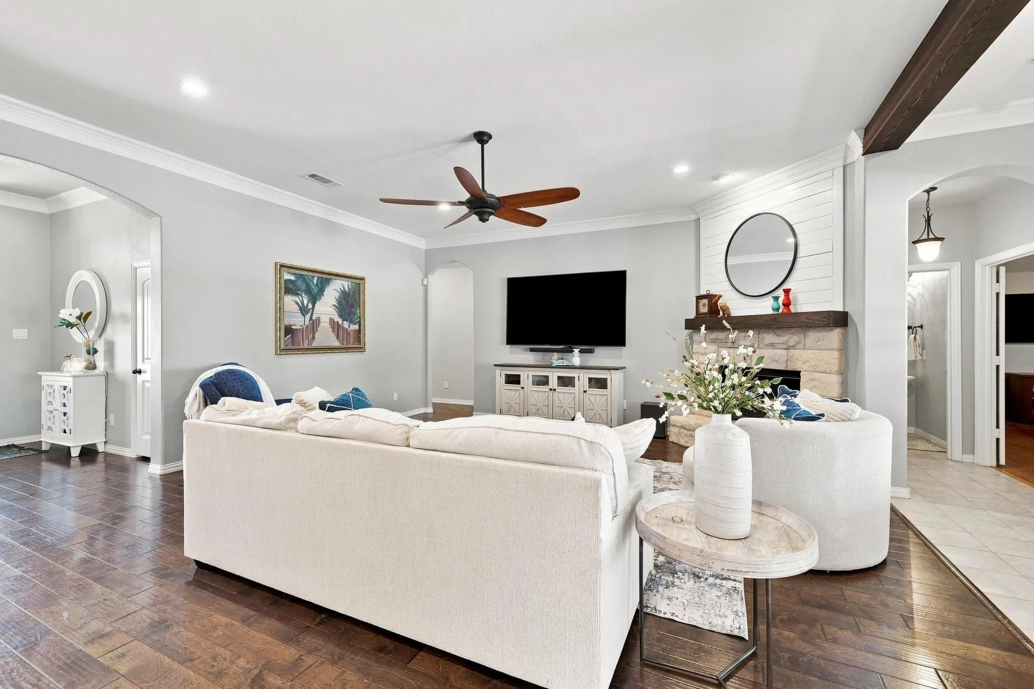 Open Concept Living. Stone Gas Fireplace, Overlooks Backyard. Neutral Palette, Warm Wood Trim.