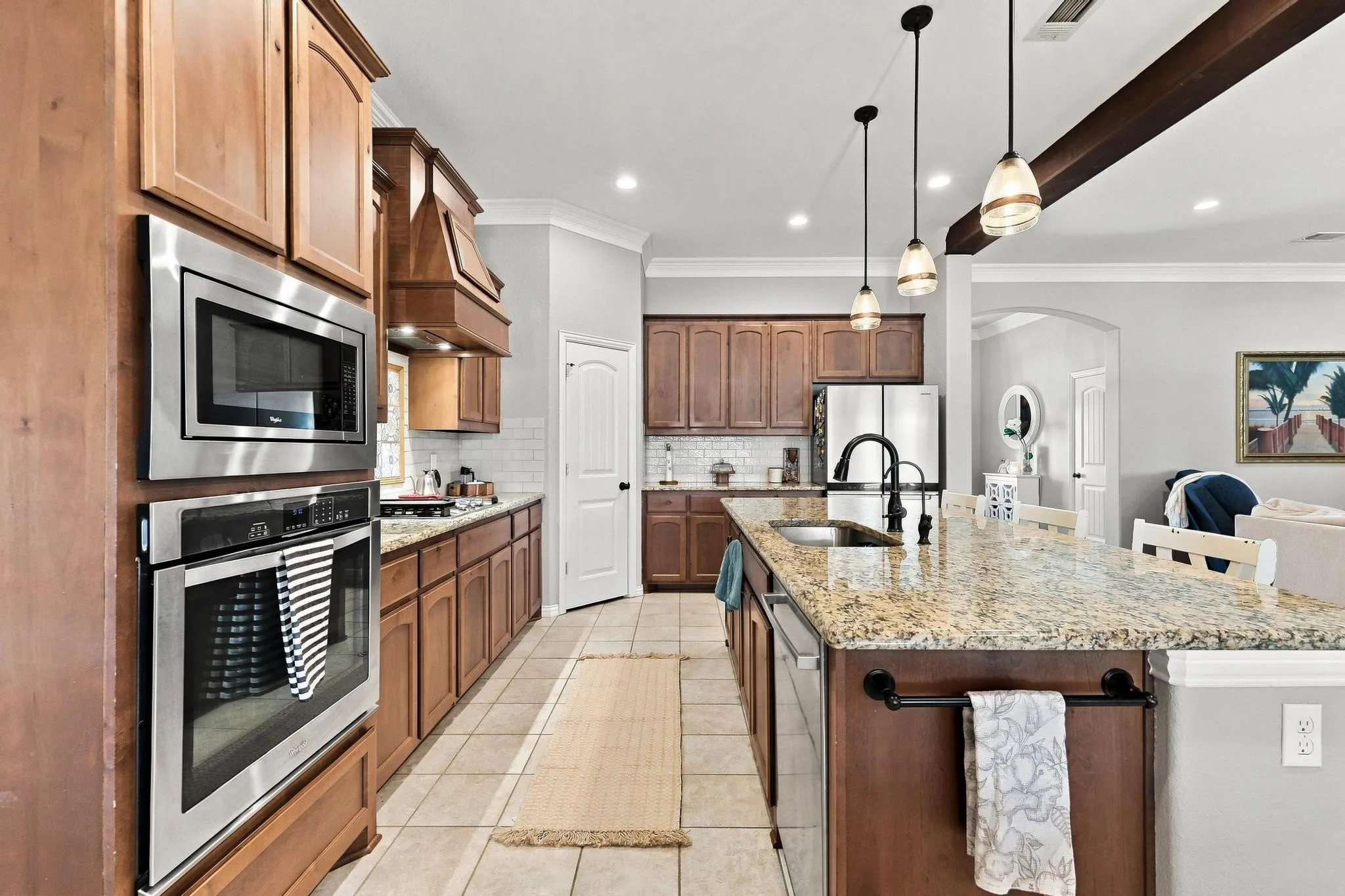  Entertainment! Gas Stovetop with Griddle, Huge Island, Warm Wood Cabinetry, Walk In Pantry.