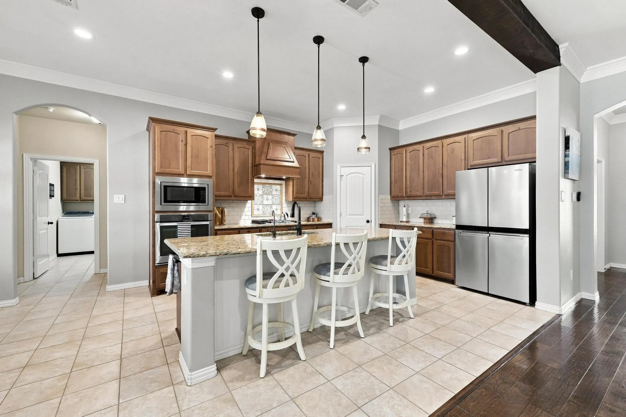  Entertainment! Gas Stovetop with Griddle, Huge Island, Warm Wood Cabinetry, Walk In Pantry.