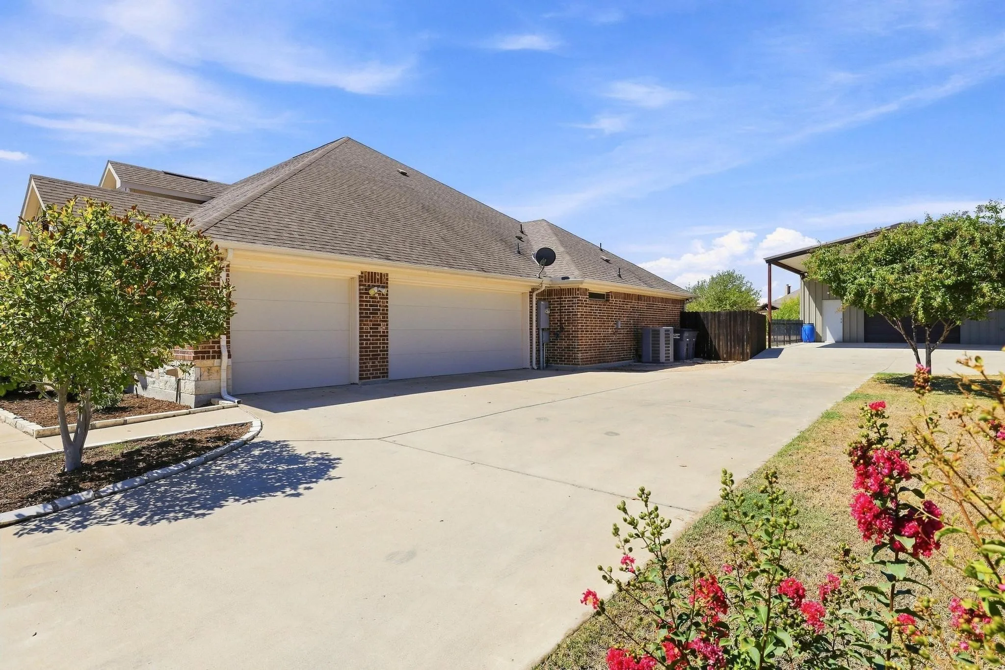 Three Car Garage, Insulated Doors, Epoxy Floors, Wurth Pro Series Garage Storage and Strong Racks.