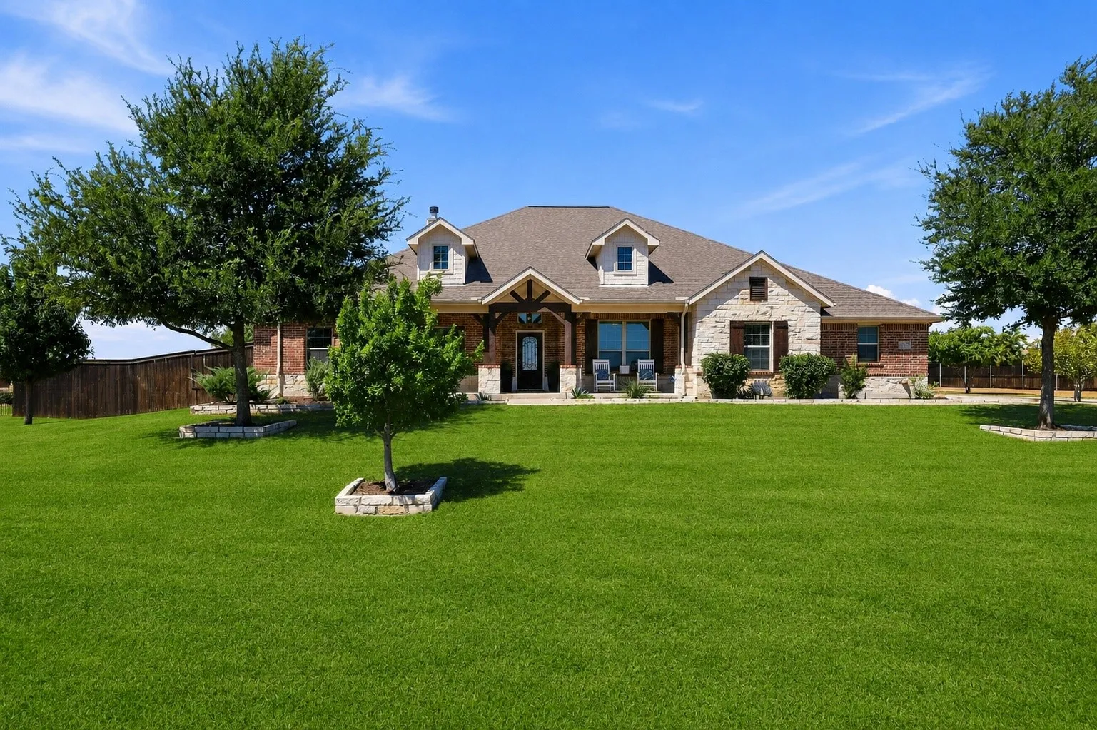 Grass Digitally Enhanced. Beautiful Riverside Homebuilders Custom Home! Great Front Porch, Perennial Landscaping.