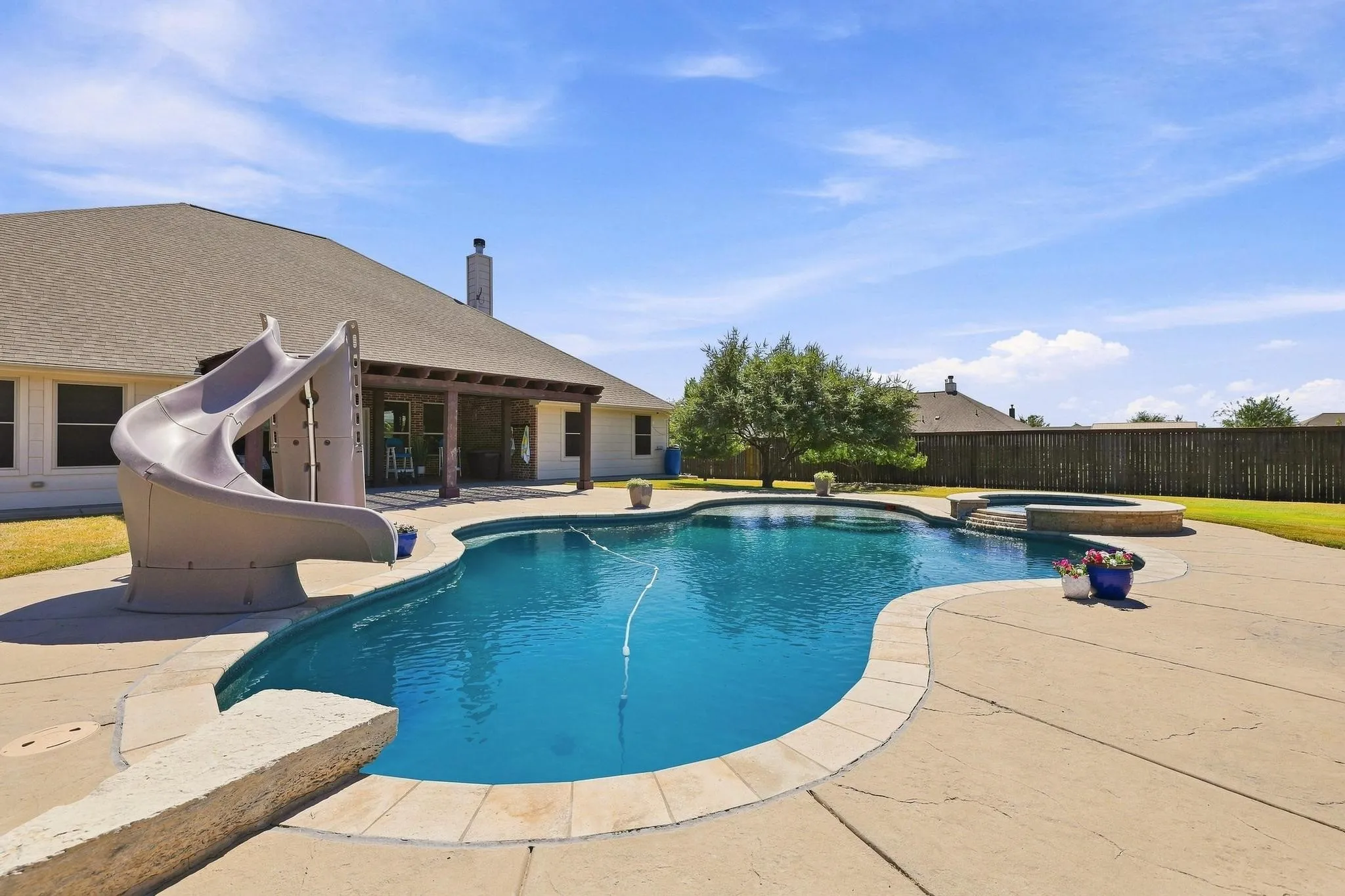 A Heated Gunite Saltwater Pool and Spa with all the Bells and Whistles! Lights, Sundeck, Slide and More!