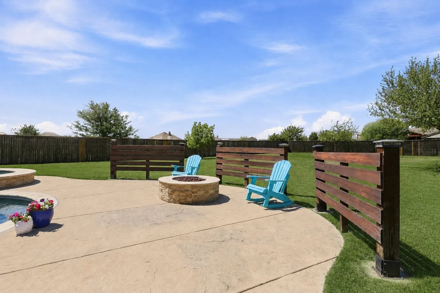 Grass is digitally enhanced. Gas Firepit for Roasting Weenies and Marshmallows!