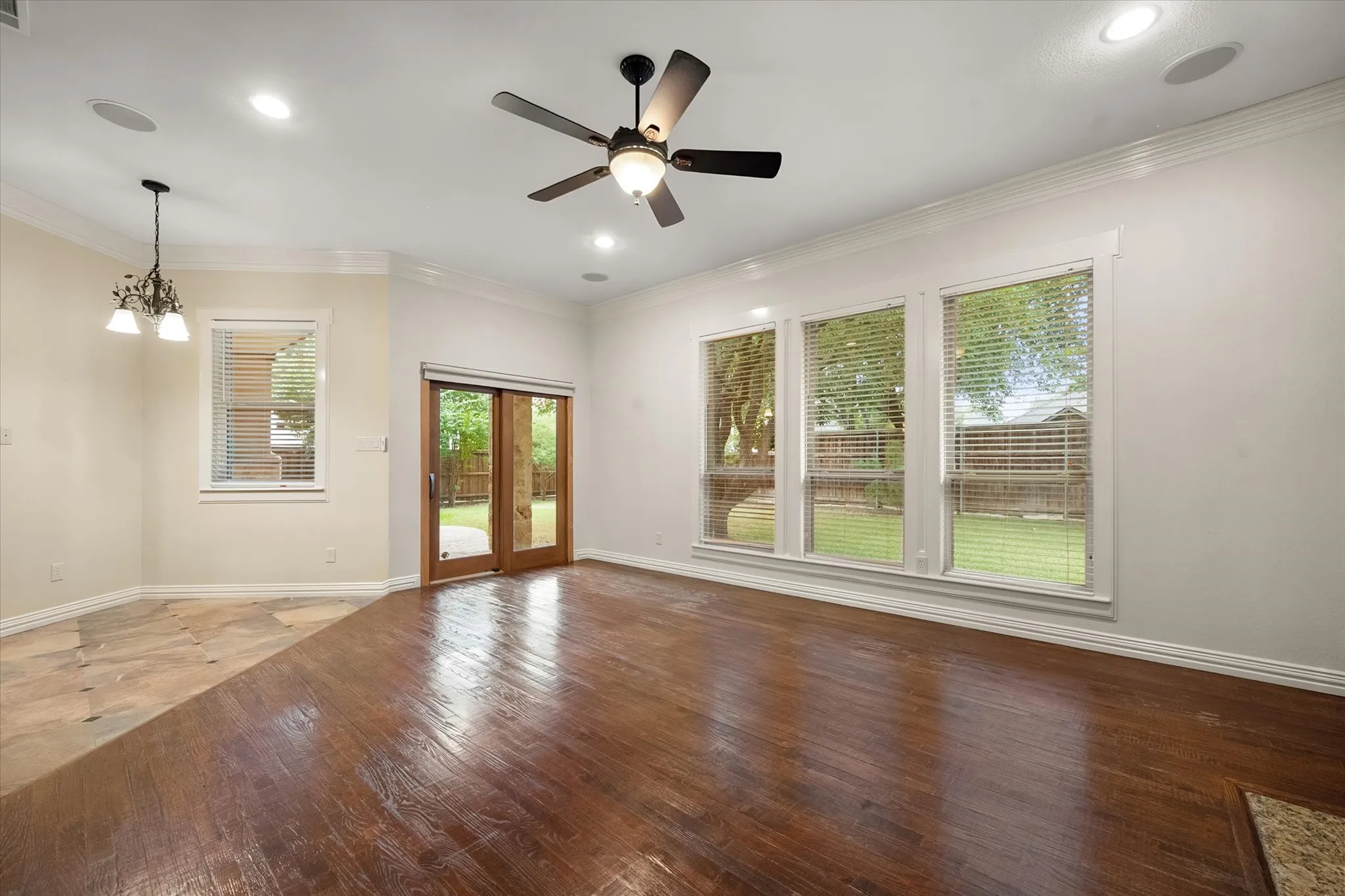 Family room with access to back patio and big windows for a great view of the backyard.