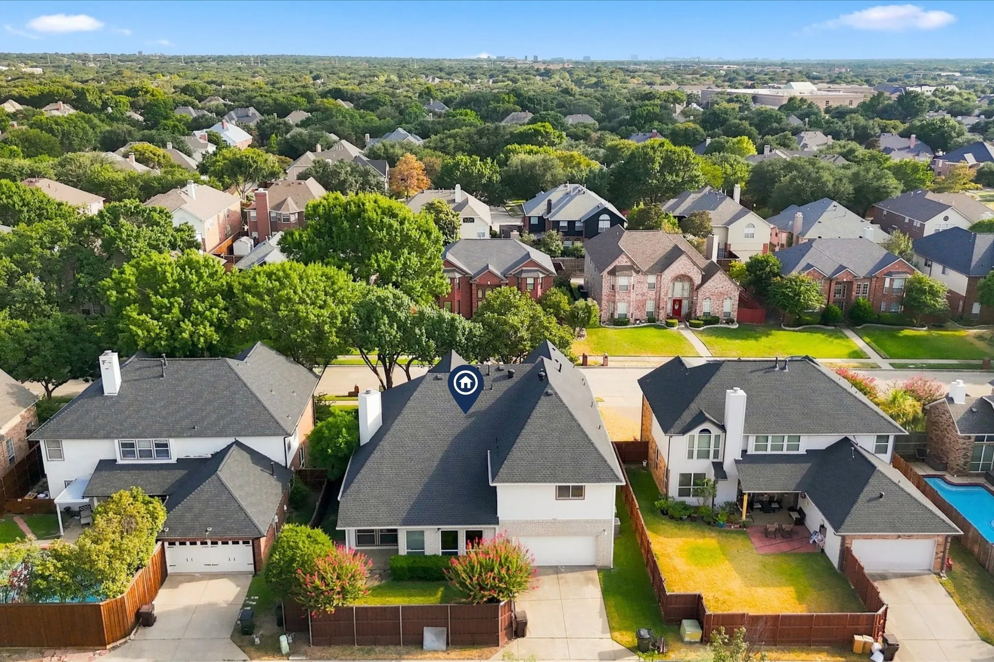 A rear-entry garage with alley access keeps the front of the home clean and inviting, while the new roof installed in 2025 adds valuable peace of mind.