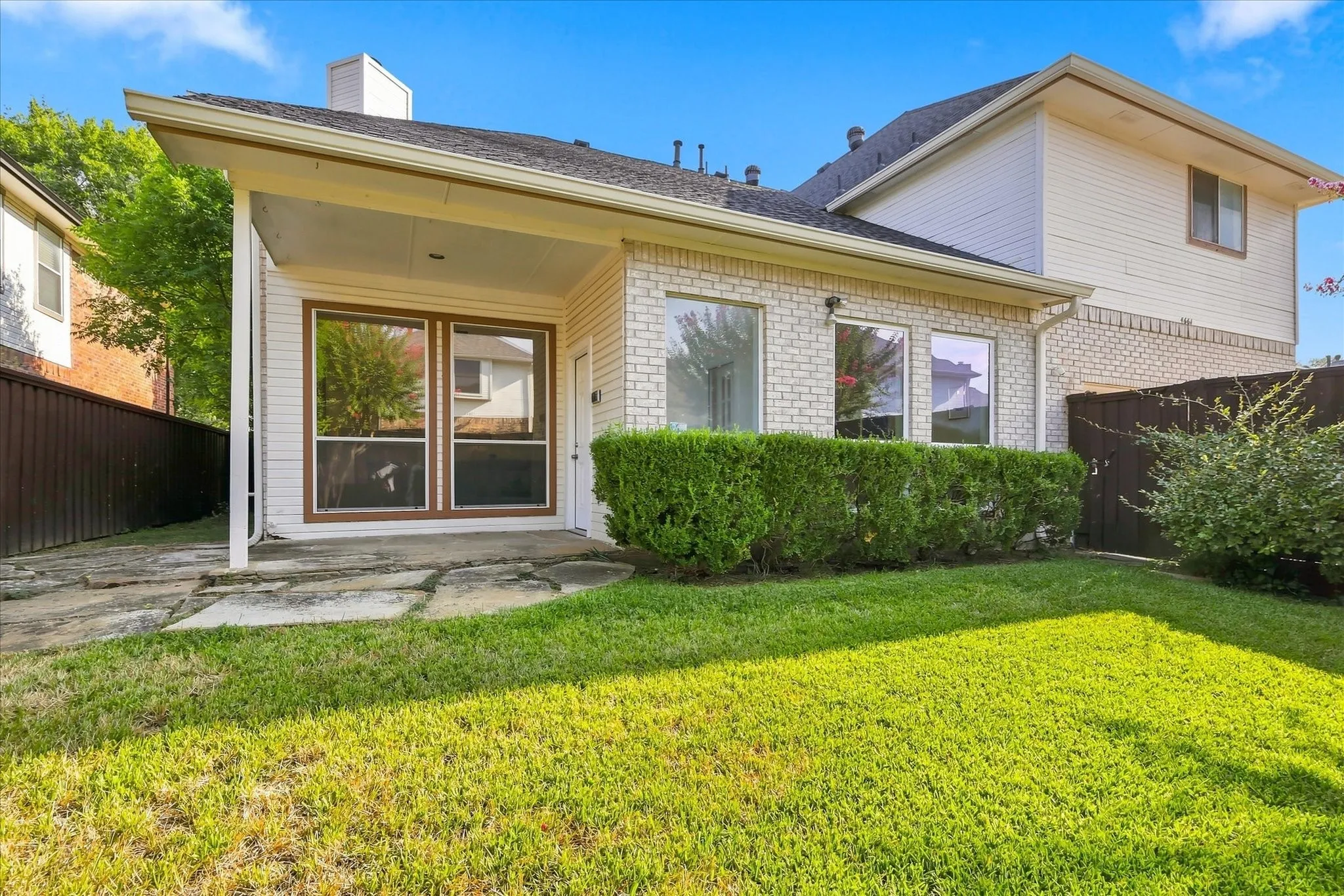 A covered patio in the backyard creates the perfect spot to relax, grill, or enjoy a little fresh air without being in the full sun.