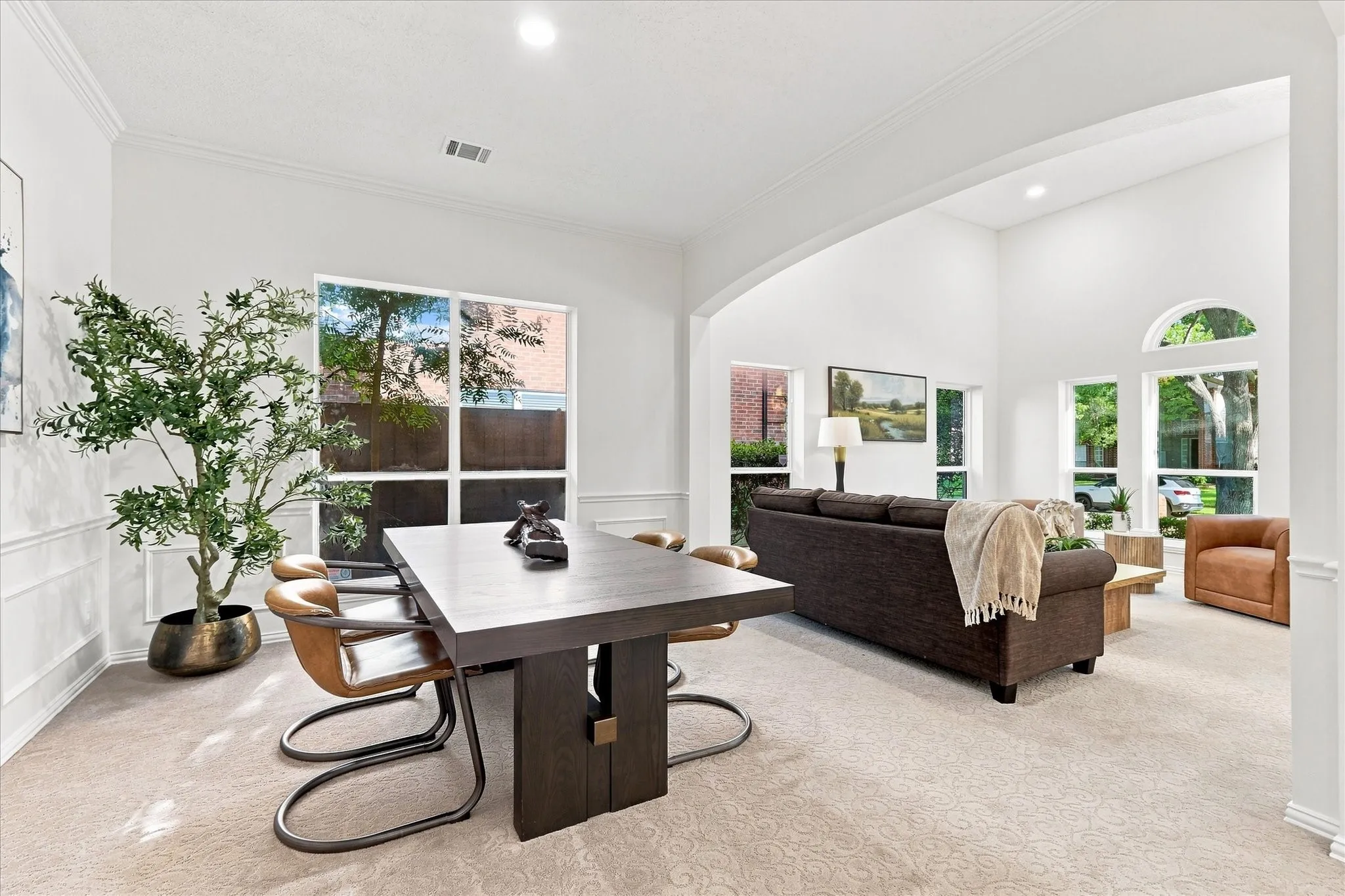 The spacious open floorplan offers a seamless flow between the stacked formal living and dining spaces, creating an inviting setting for both everyday living and effortless entertaining.