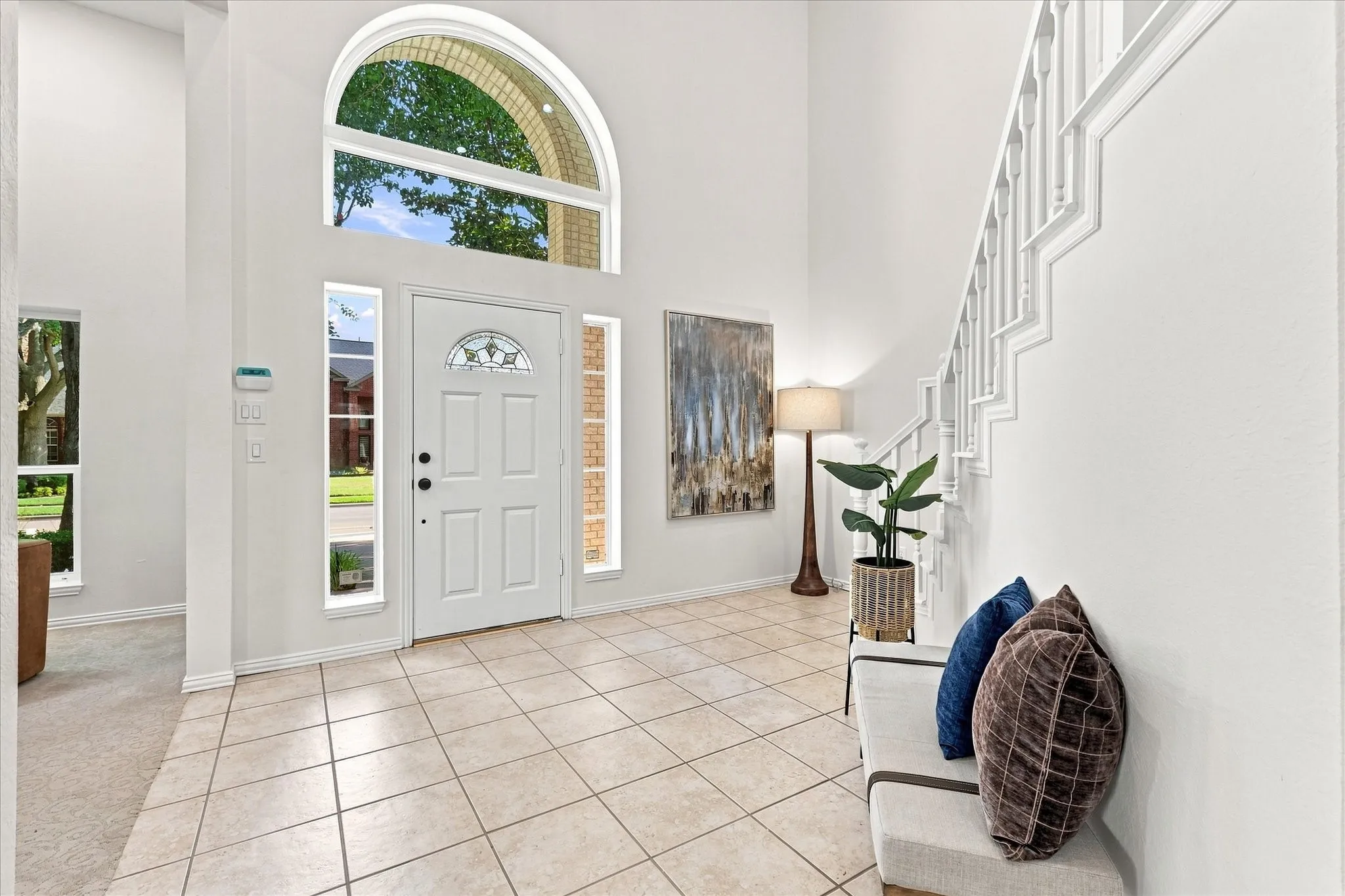 A spacious entryway welcomes you with soaring ceilings and an abundance of natural light, creating an impressive yet inviting first impression. With a fresh, versatile canvas, this space is ready for its next owner to make it their own and bring their personal style to life.
