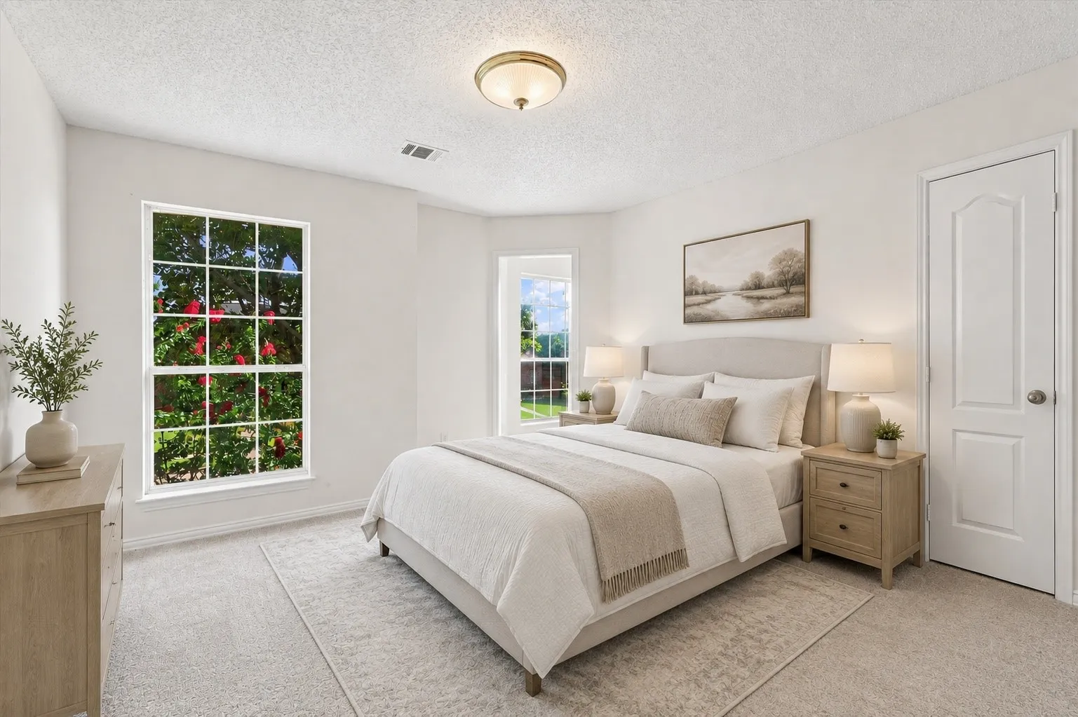 One of three bedrooms upstairs, featuring new carpet and easy access to a Jack-and-Jill bath. Virtually staged to show its potential.