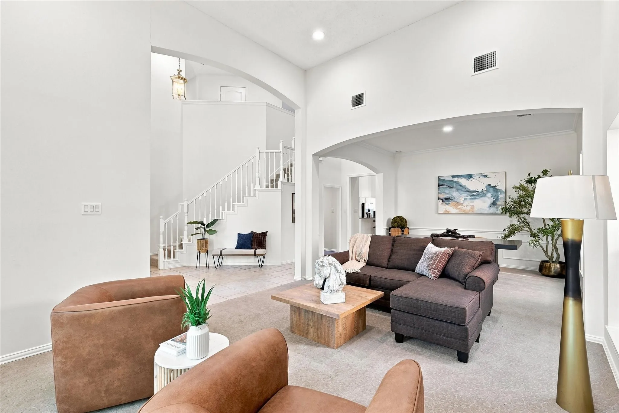 From the welcoming entry, the home flows naturally into the spacious stacked formal living and dining areas, creating an open, connected layout that feels both elegant and effortless.