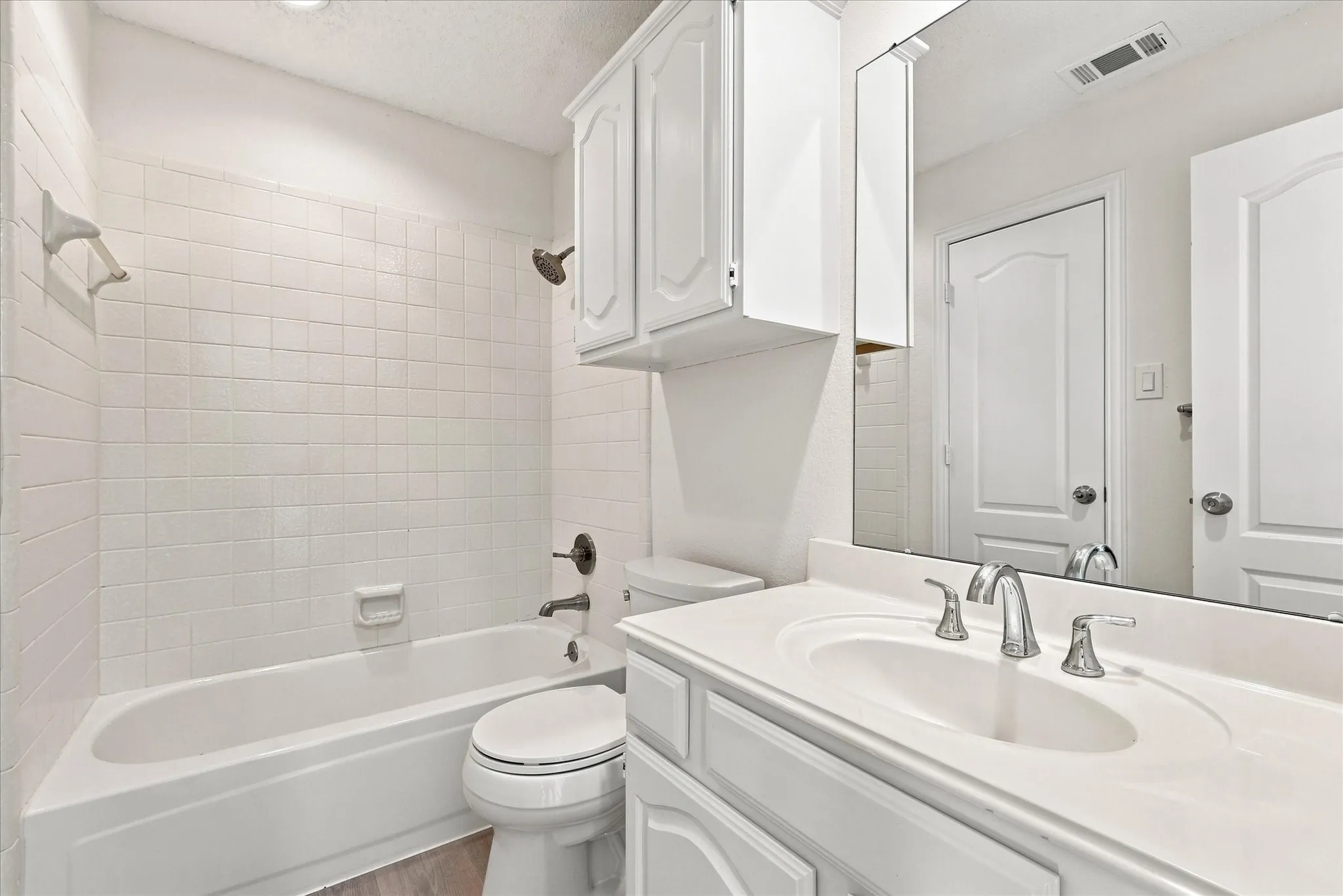Upstairs bathroom conveniently shared by one bedroom and the loft, keeping everyday routines easy and convenient.