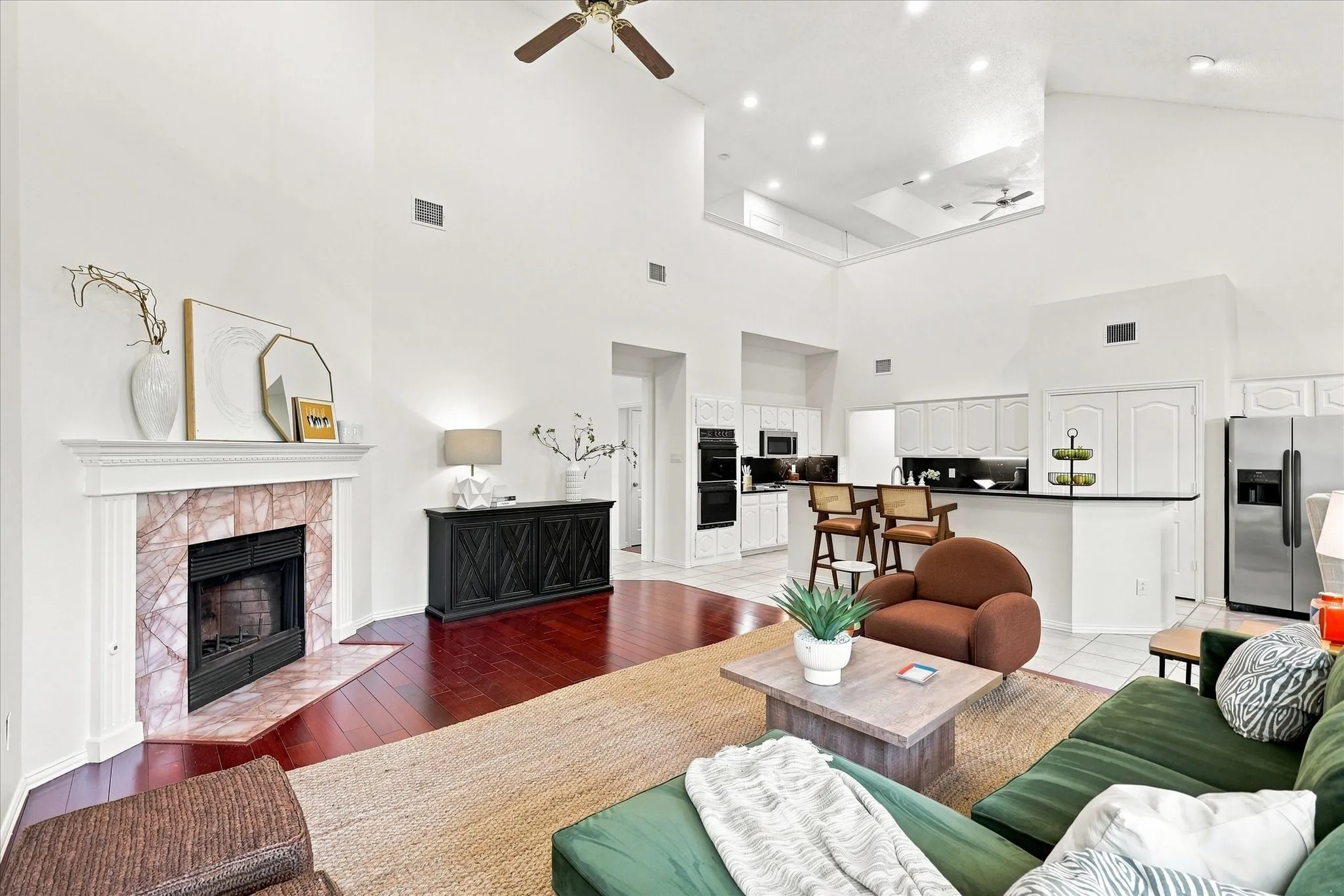 Gather, relax, and make yourself at home in the inviting family room, where soaring ceilings, warm hardwood floors, and a cozy fireplace create the perfect backdrop for everyday moments. Whether it’s a quiet evening in or time spent together, this is a space designed to be enjoyed.