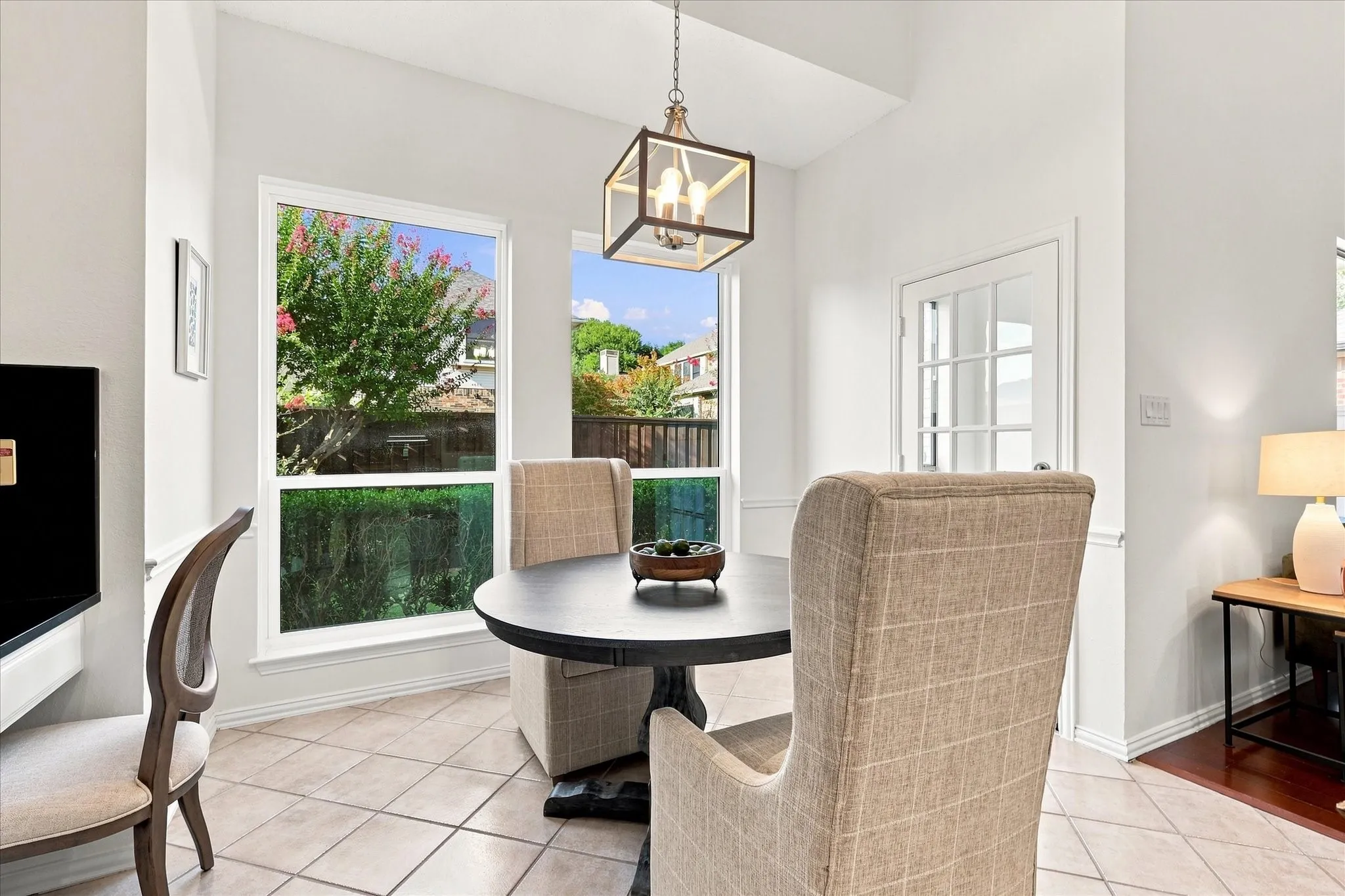 The bright breakfast room is made for more than morning coffee, with a built-in workspace that’s perfect for meal planning, paying bills, or keeping devices charged while you stay connected to the heart of the home.