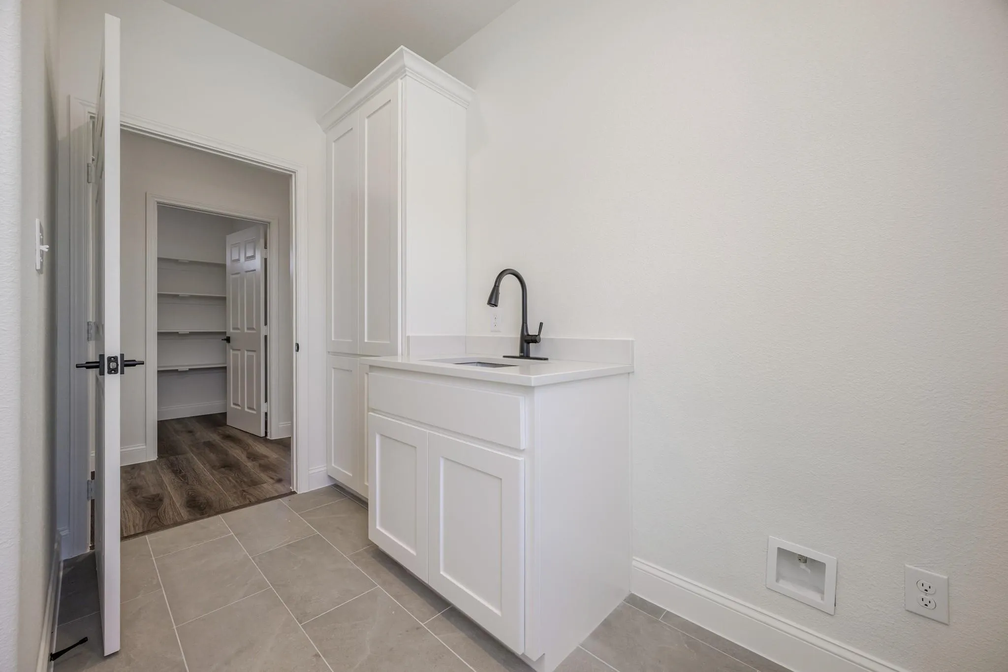 Spacious laundry with water line for secondary fridge