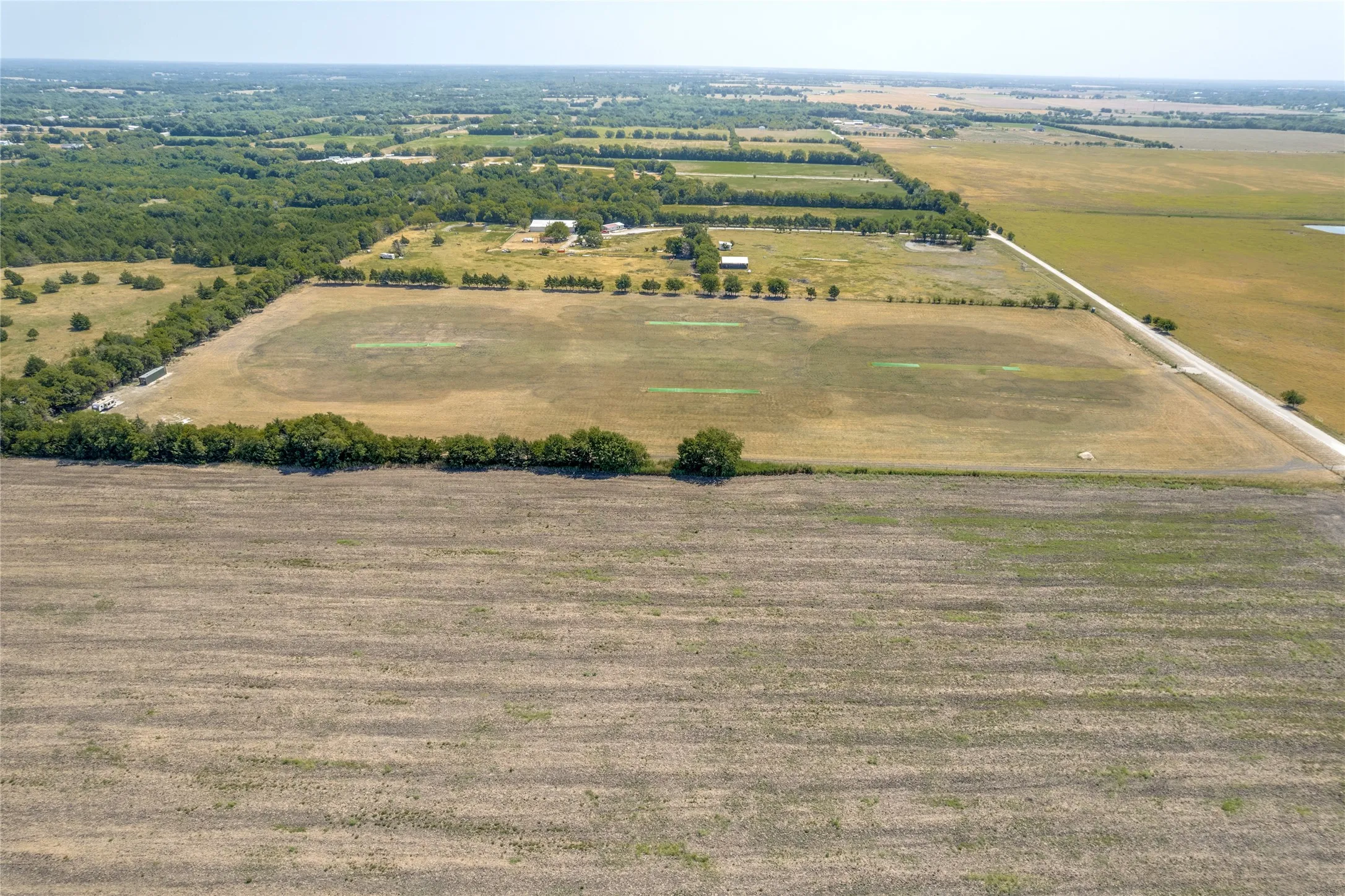 Additional contentThis aerial photograph does not contain sufficient detail of permanent structures, architectural features, or hardscaping elements to support a compliant property description