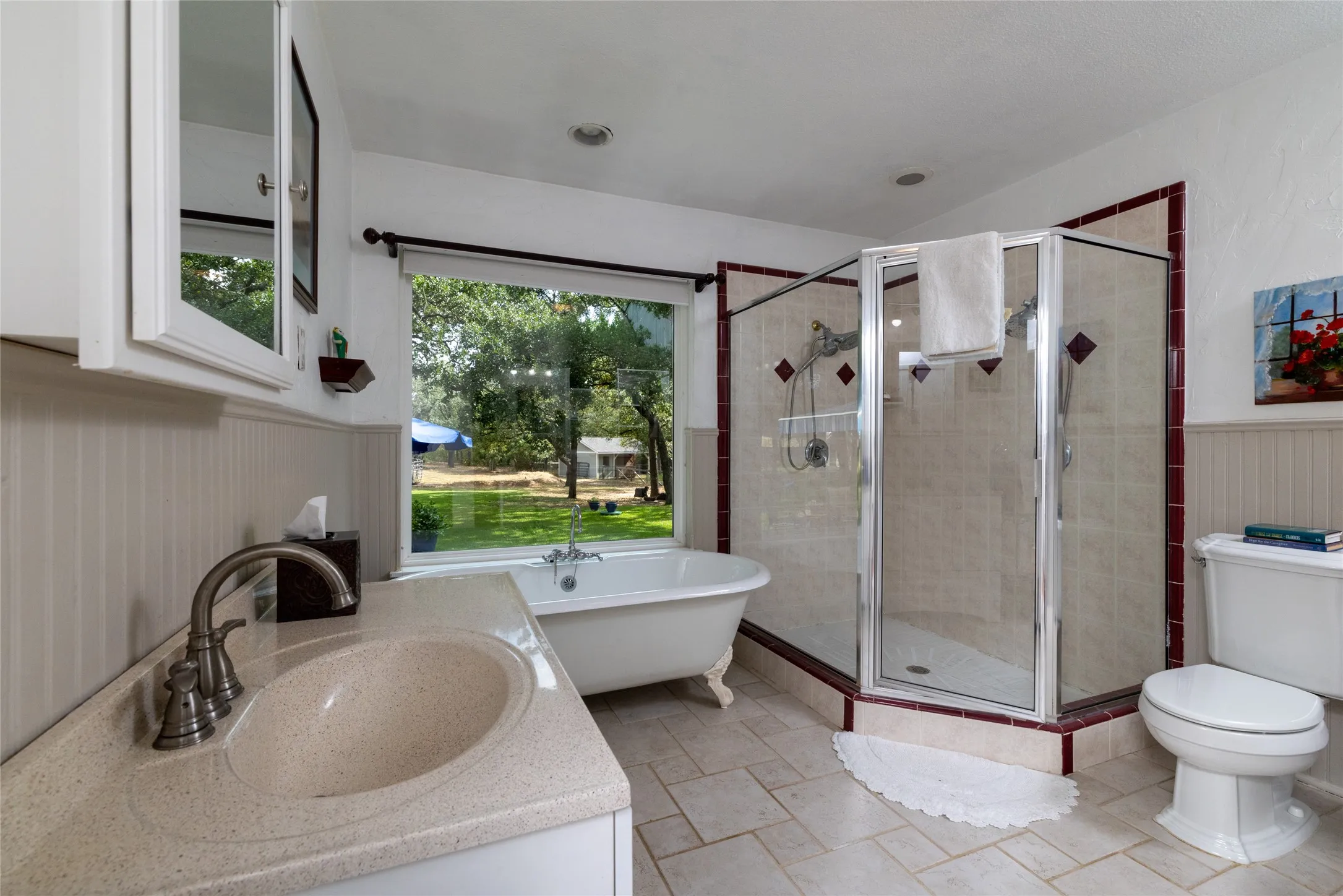 A glass shower and double sinks make mornings easy.