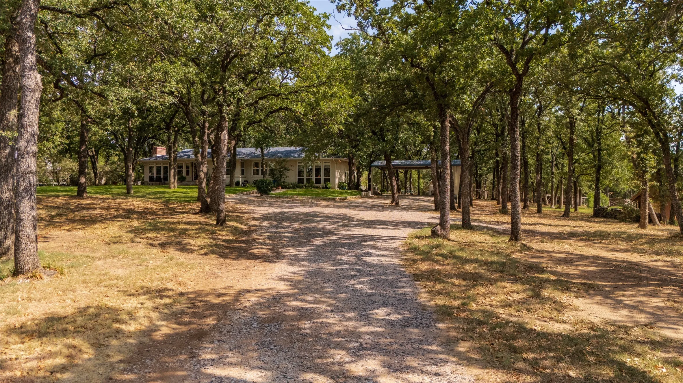 A quiet drive through the trees leads to even more space.