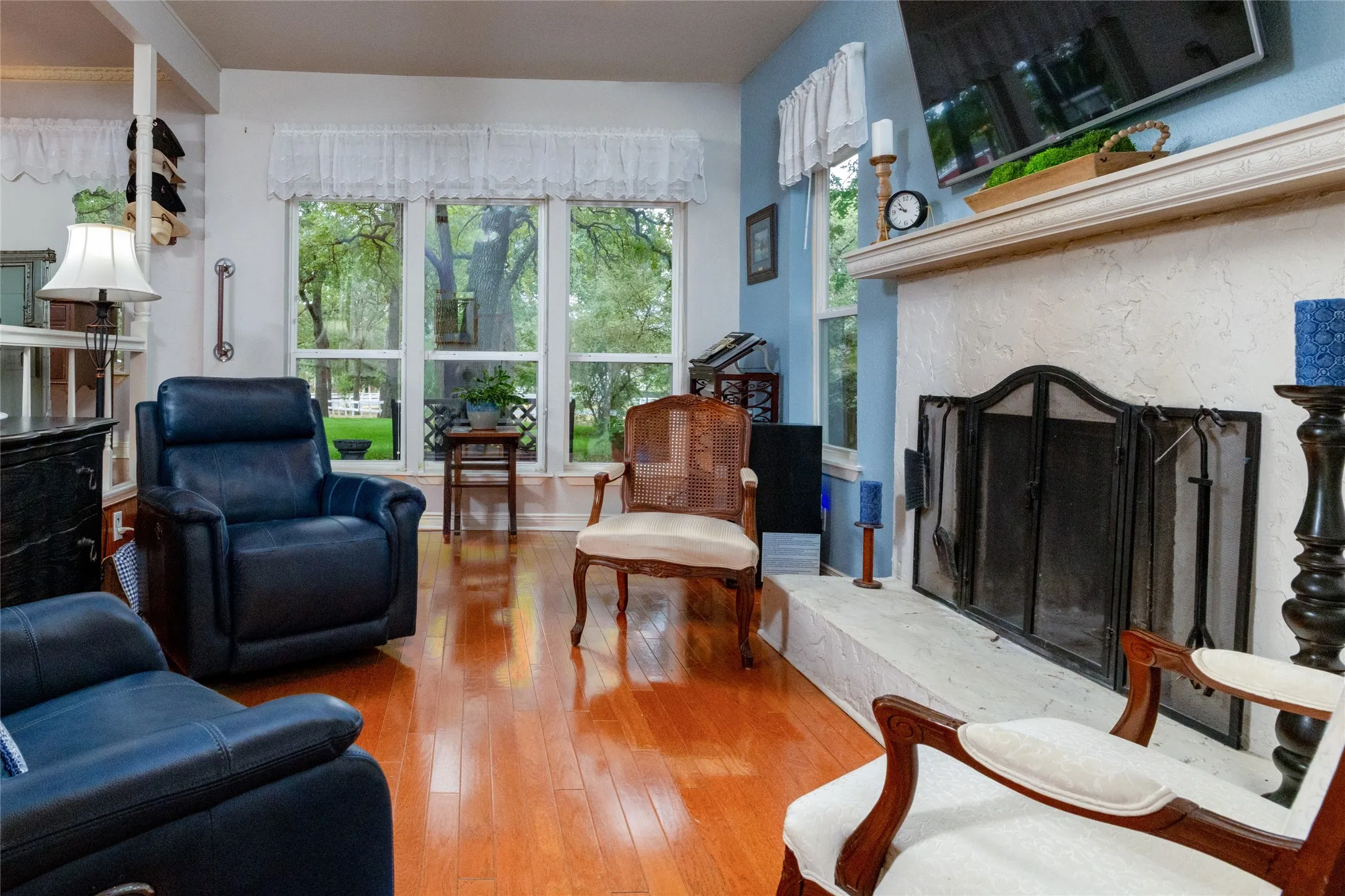 Rich floors and a classic fireplace. Simple and inviting.