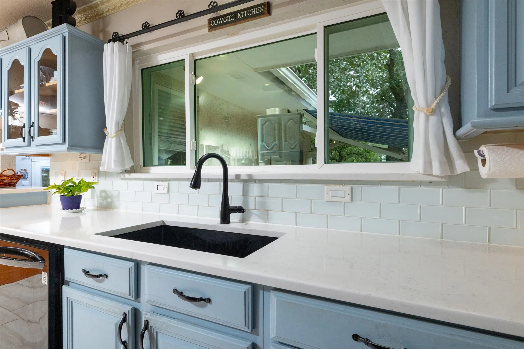 Do the dishes with a view. Natural light pours in over this sink.