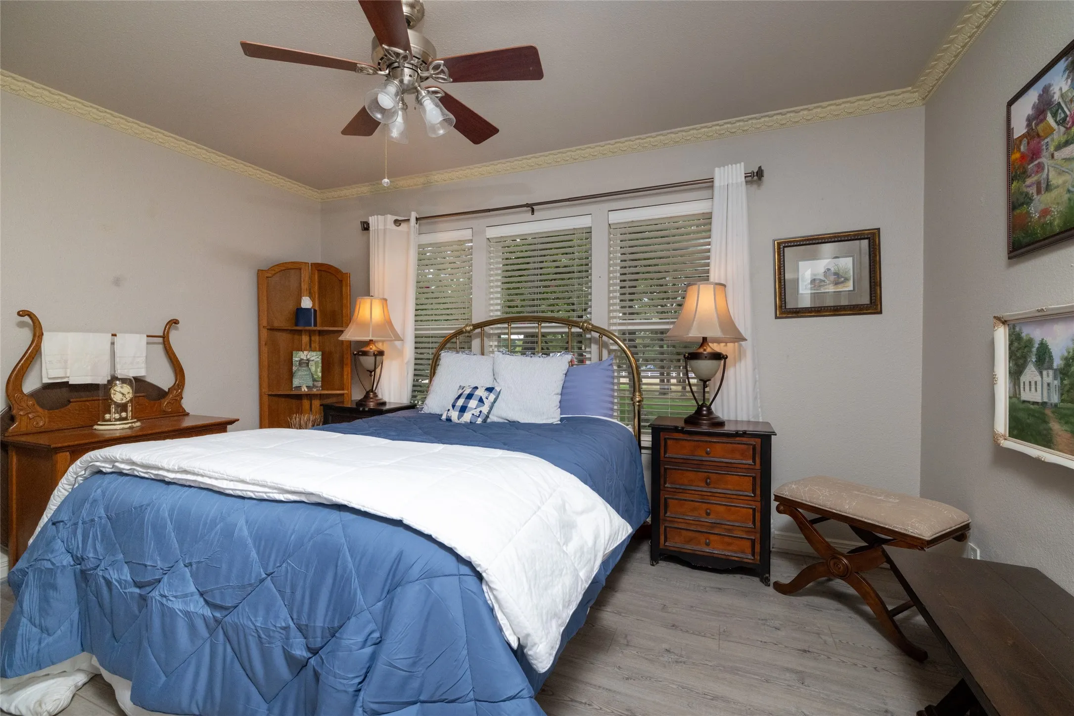 A restful bedroom with plenty of natural​​‌​​​​‌​​‌‌​‌‌​​​‌‌​‌​‌​‌​​​‌​​ light.
