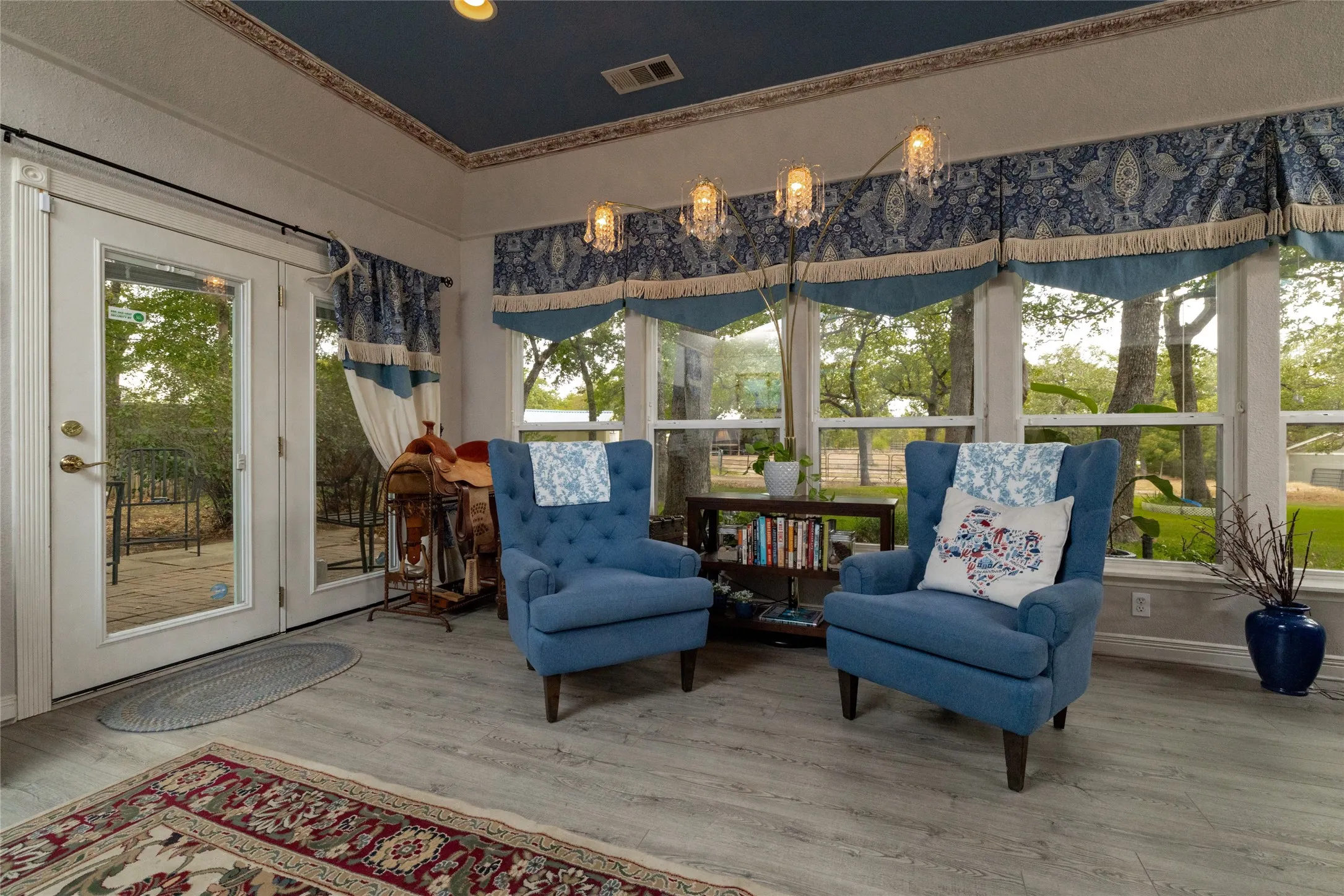 Blue accents and big windows make this room feel light and happy.