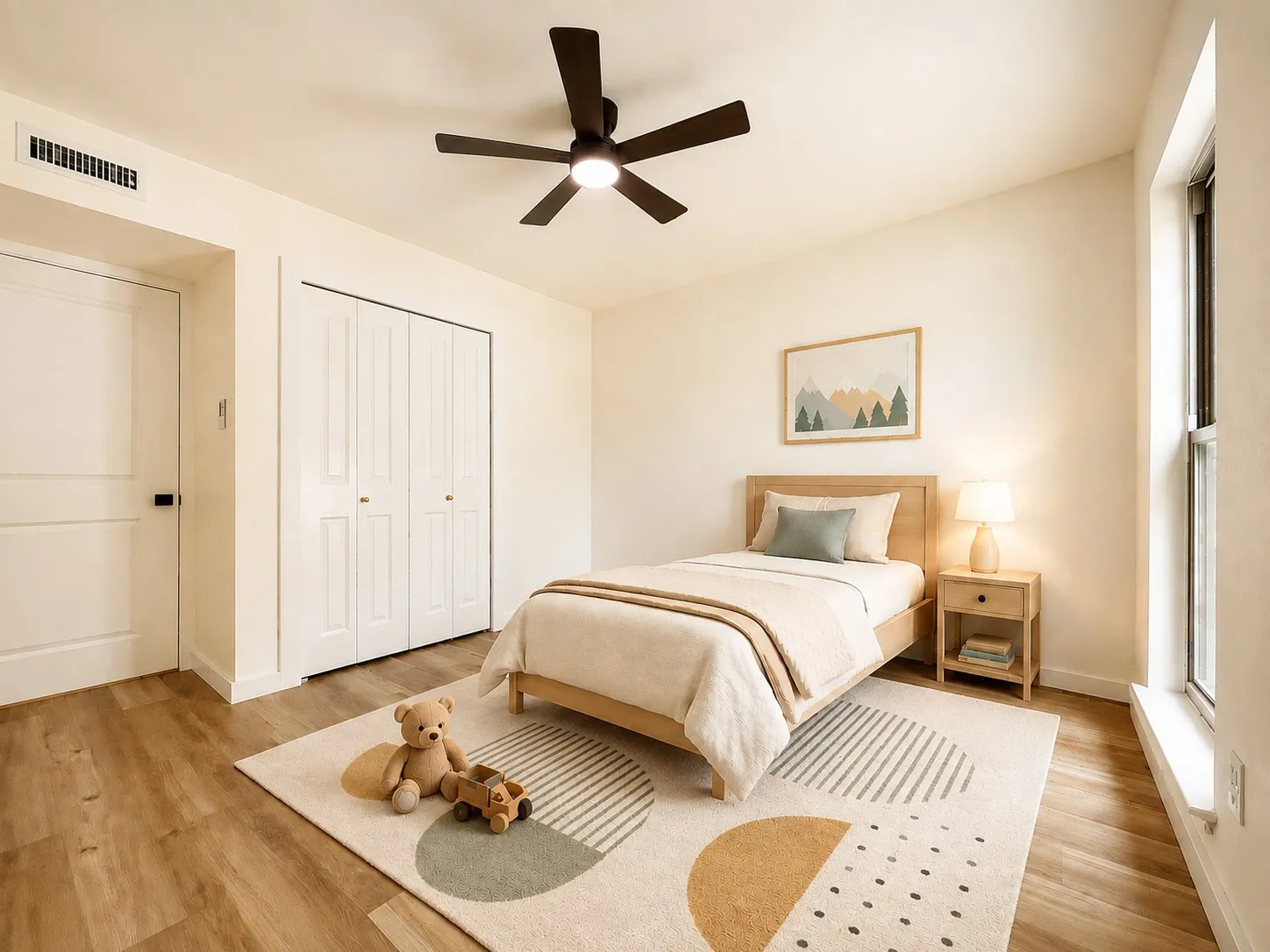 Wood-finish flooring, two-panel closet doors, white walls, and a ceiling fan with integrated lighting