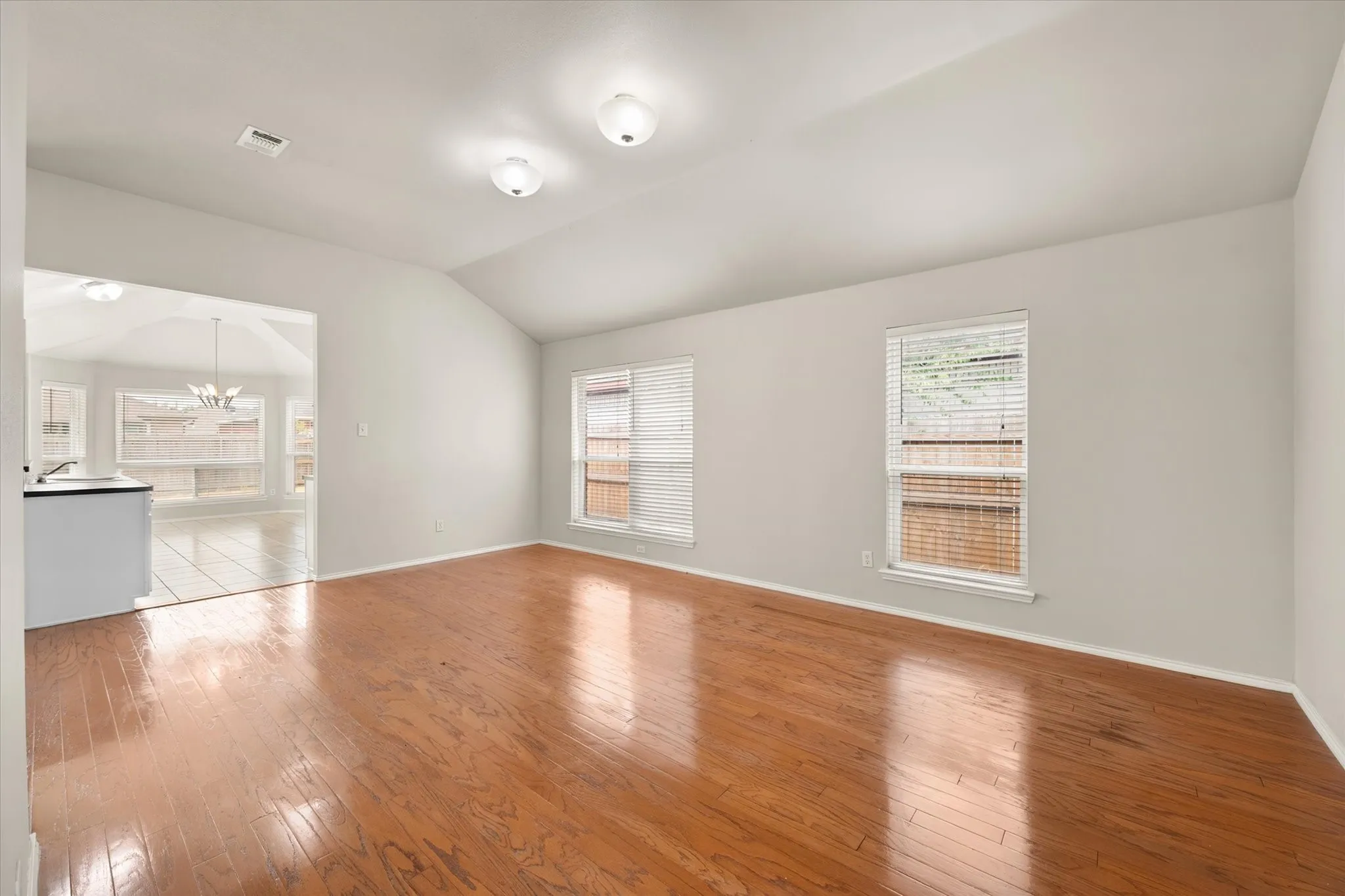 This room can be used as dining room or extra living area.  Wood floors